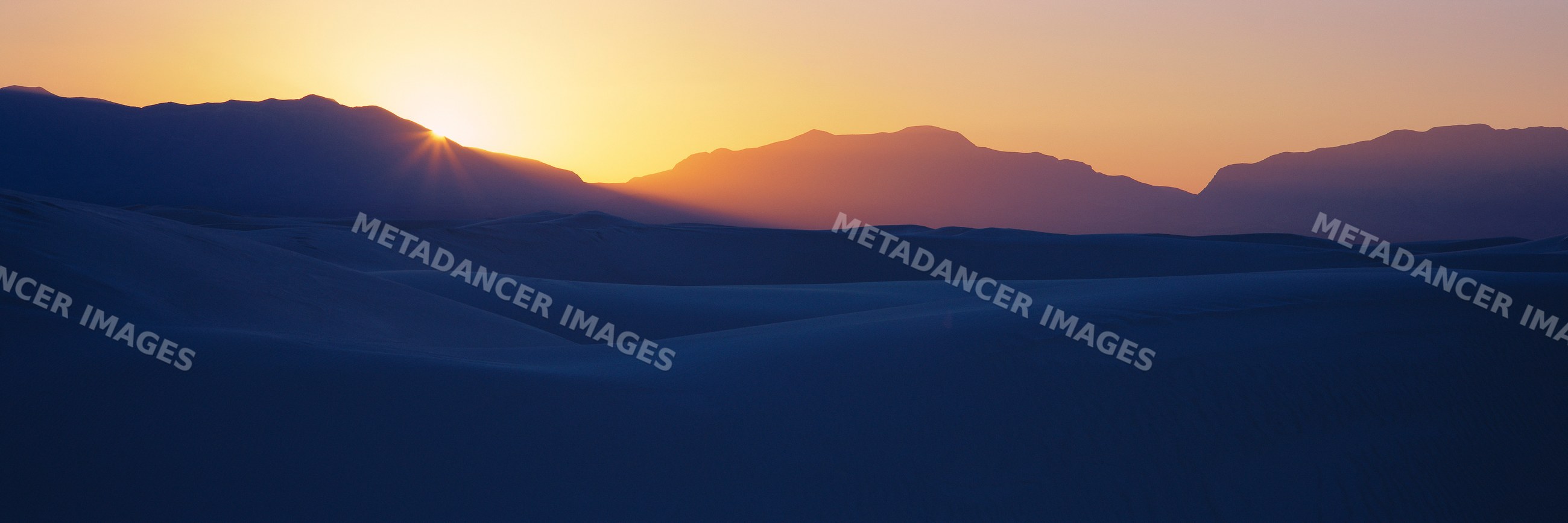 Sunrise over sand dunes