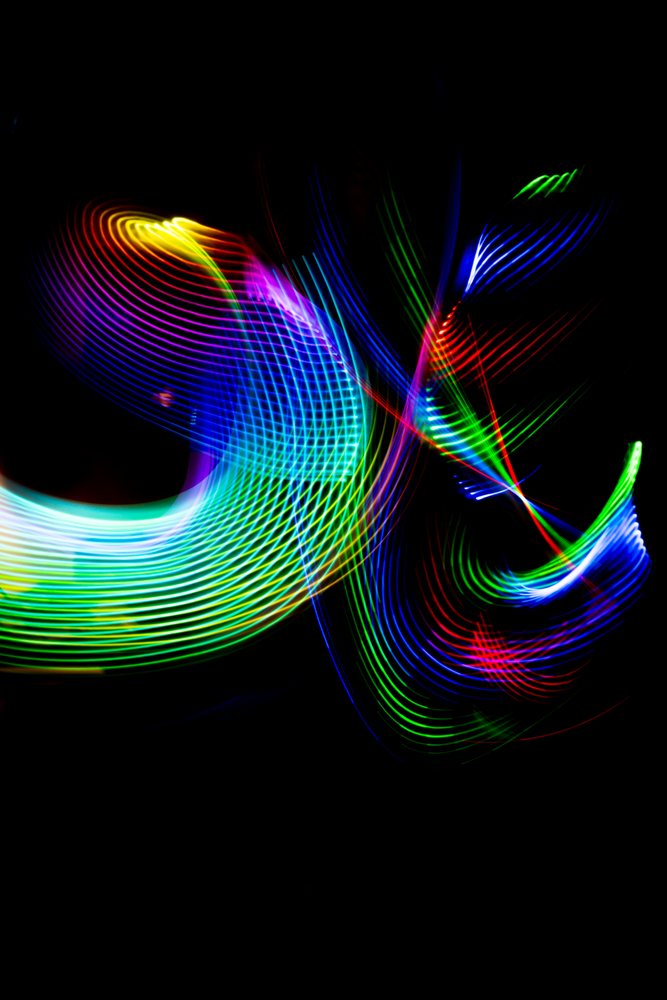 Colorful LED light painting with abstract patterns and motion blur