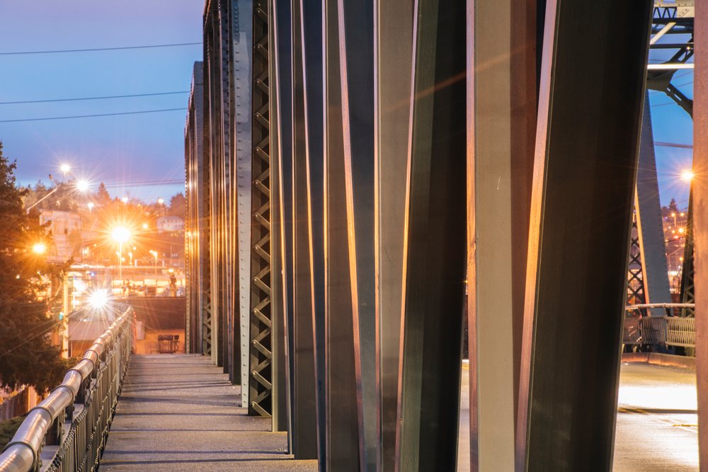 Steel bridge with sidewalk and streetlights in Tacoma, washington