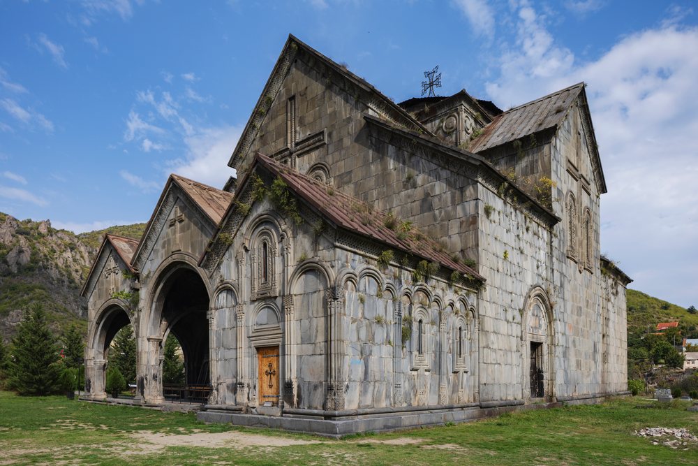 Front facade of Akhtala Monastery with stone arches