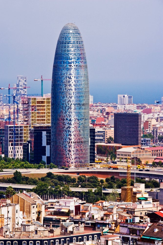 Agbar tower cityscape with construction cranes