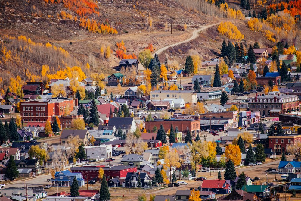 Mountain town with fall colors and hillside road in Durango Colorado