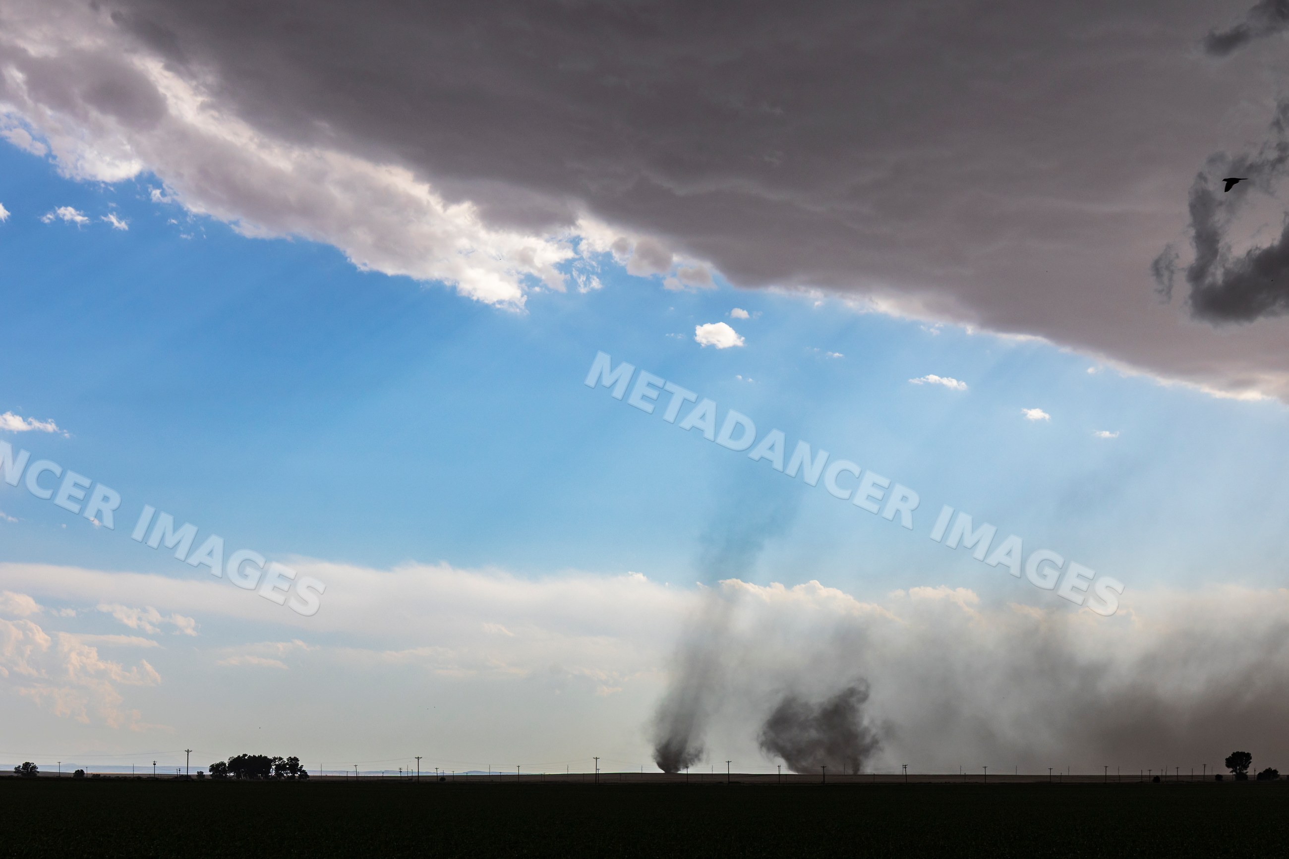 Twin tornadoes forming on county road 2 near fowler, colorado