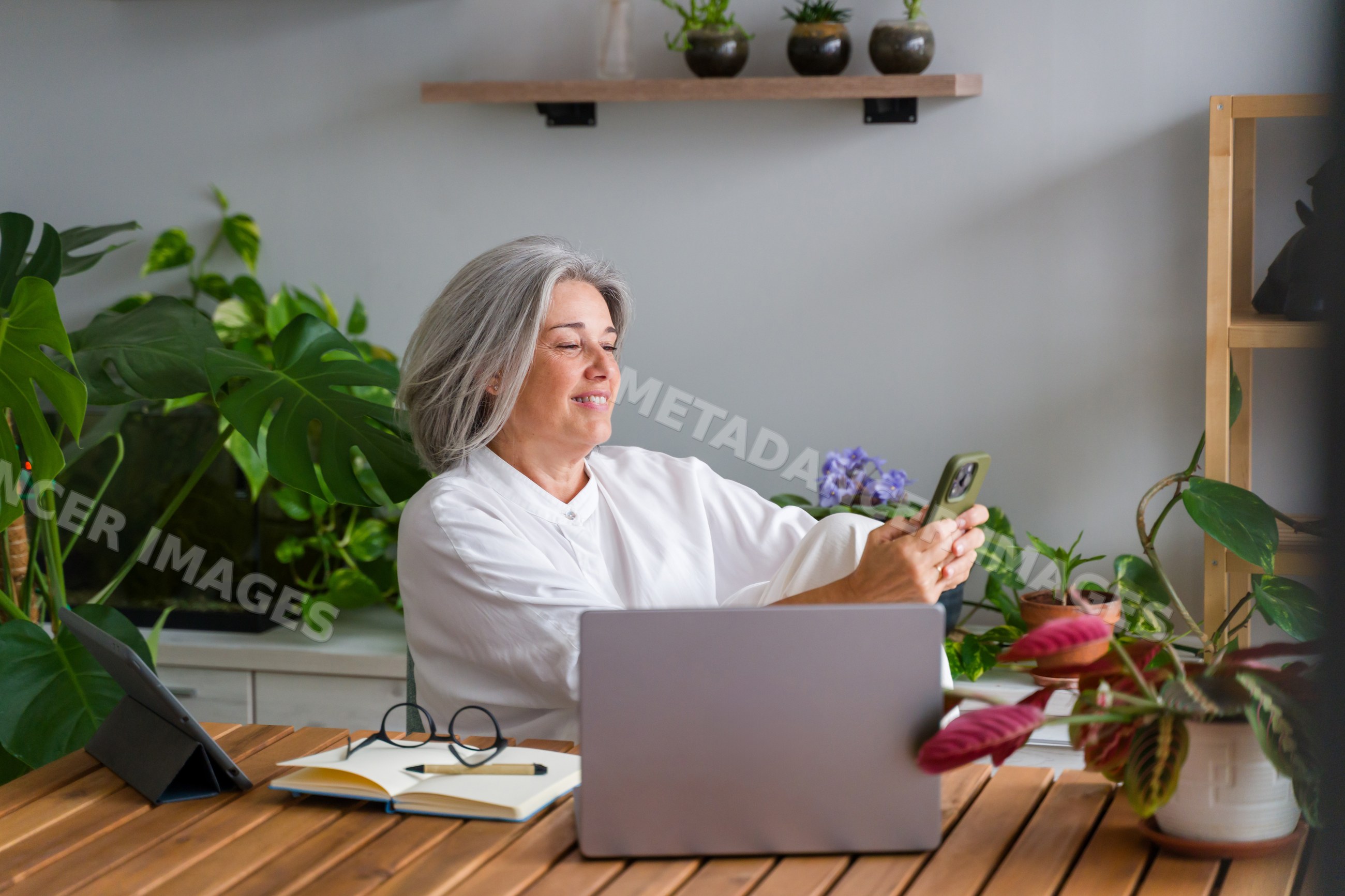 Middle aged white woman using smartphone