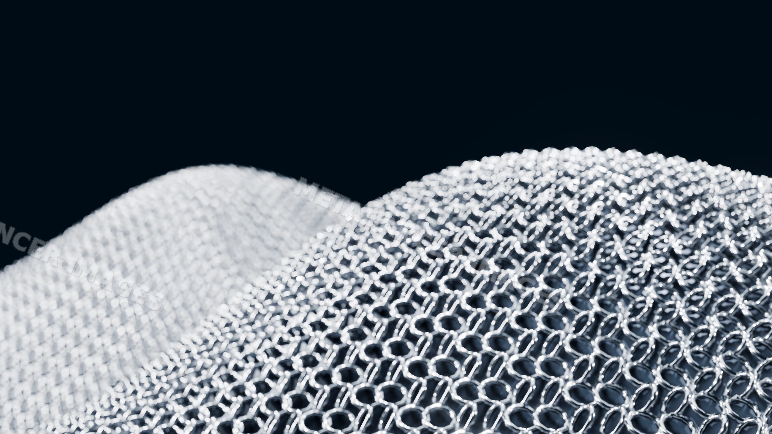 Interlocking metal chainmail armor pattern close-up