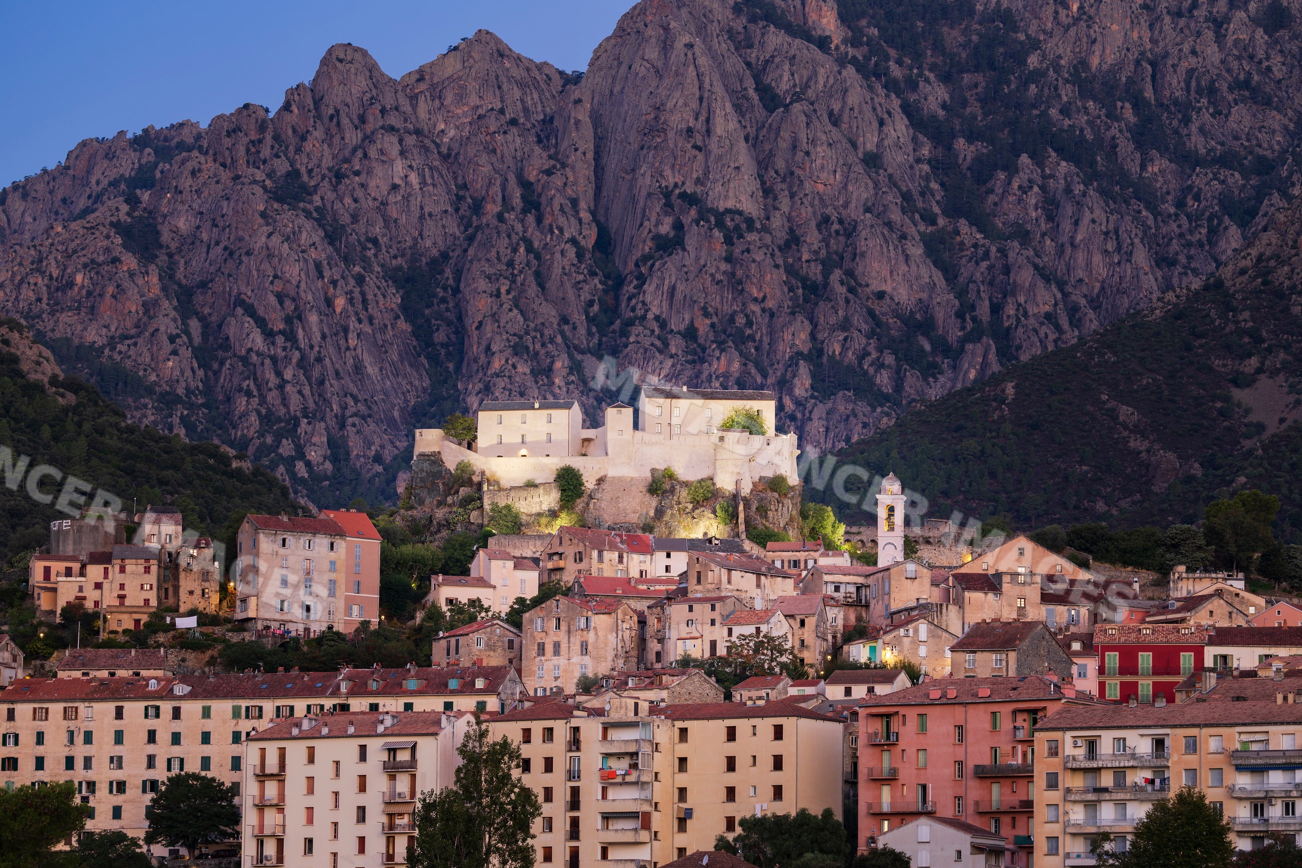 Town of Corte and fortress at Dawn under corsican mountains