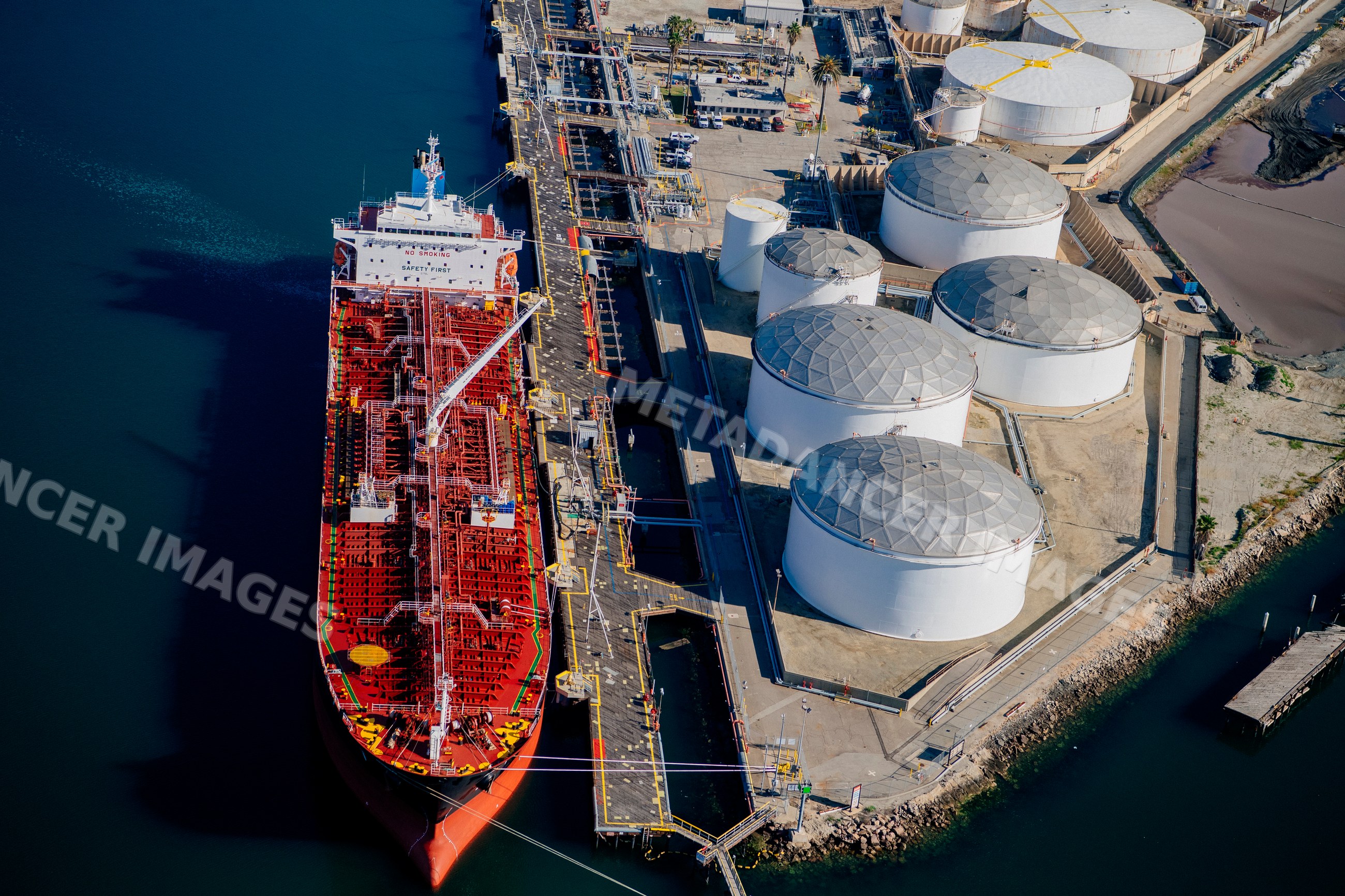 Oil tanker docked at fuel storage terminal in long beach port