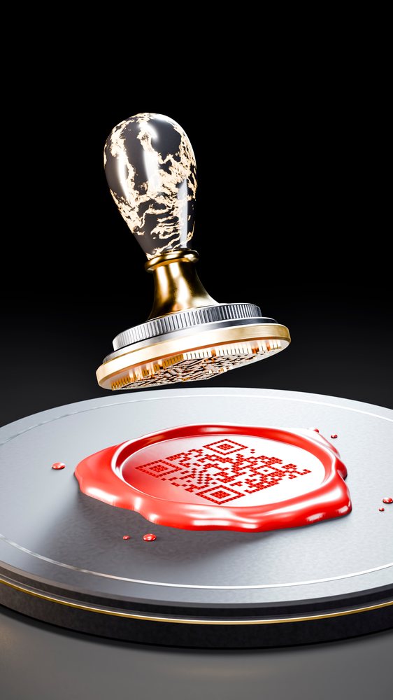 Red wax seal with qr code and brass wax stamp on metal pad