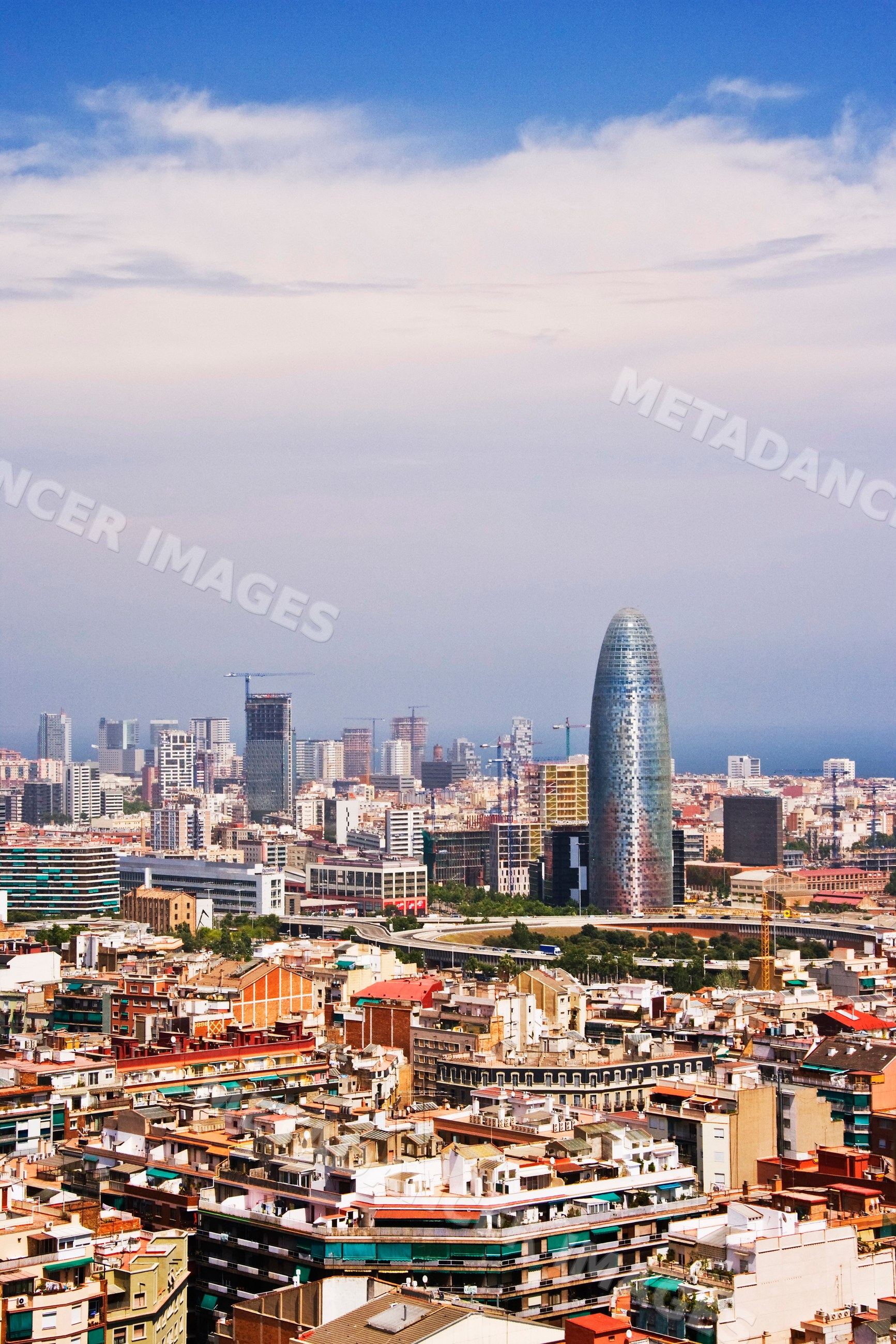 Cityscape of barcelona with torre glòries skyscraper and urban