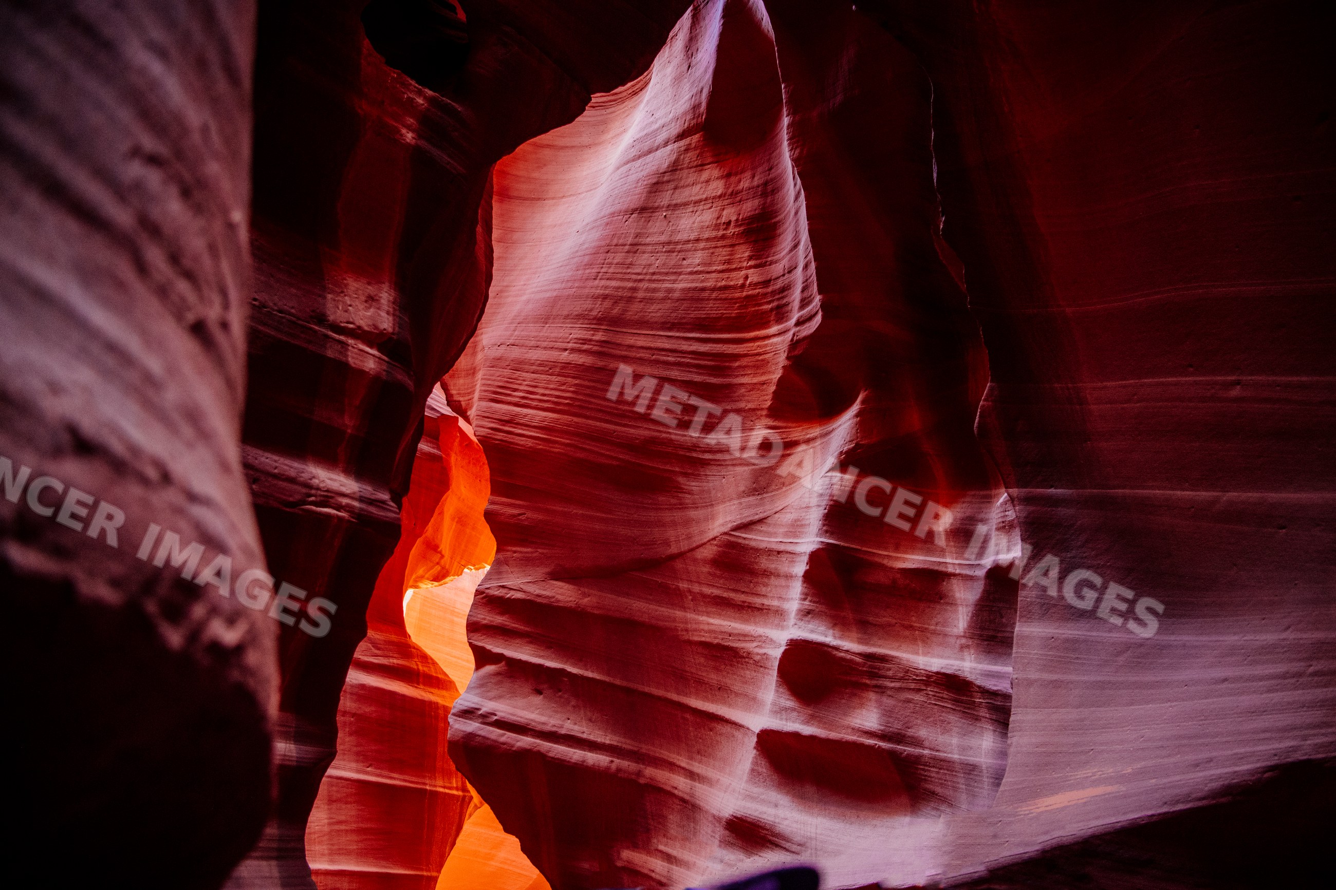 Slot canyon with red and orange sandstone formations in Navajo Land