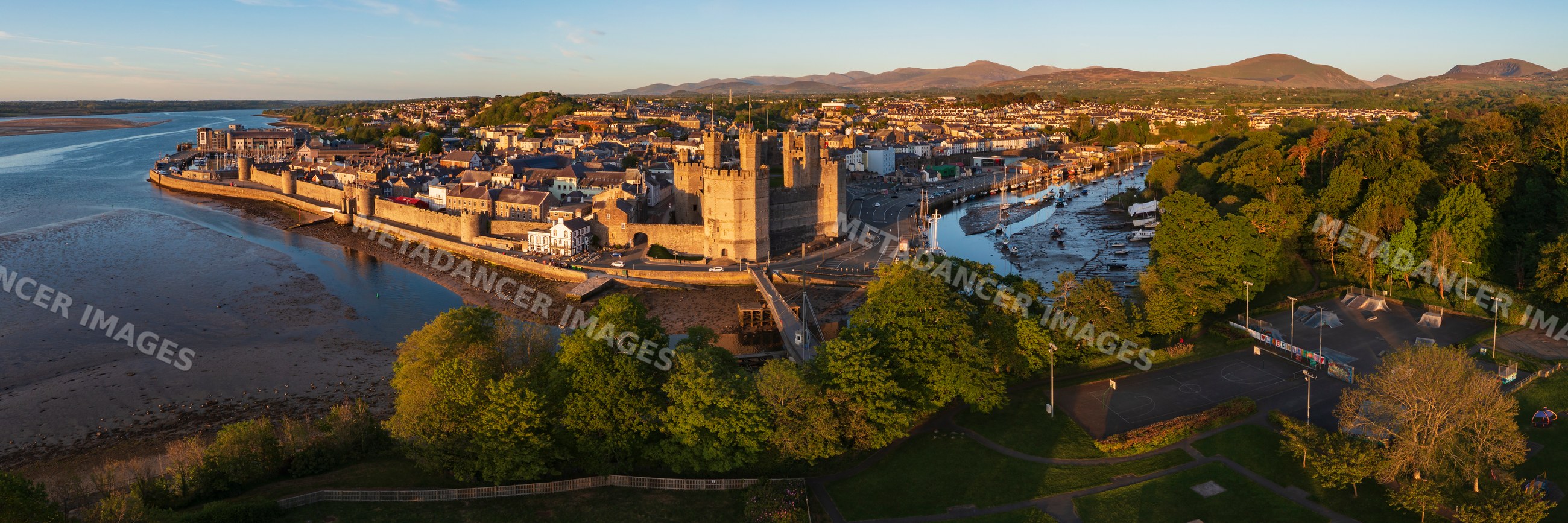 Aerial view of Caernarfon Castle at Sunset in Wales