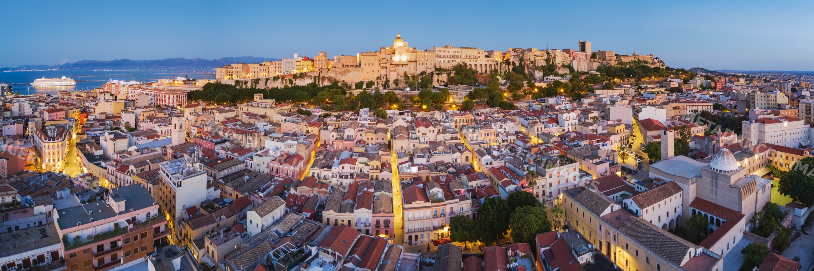 Panoramic evening view of cagliari's Stampace District and Citadel