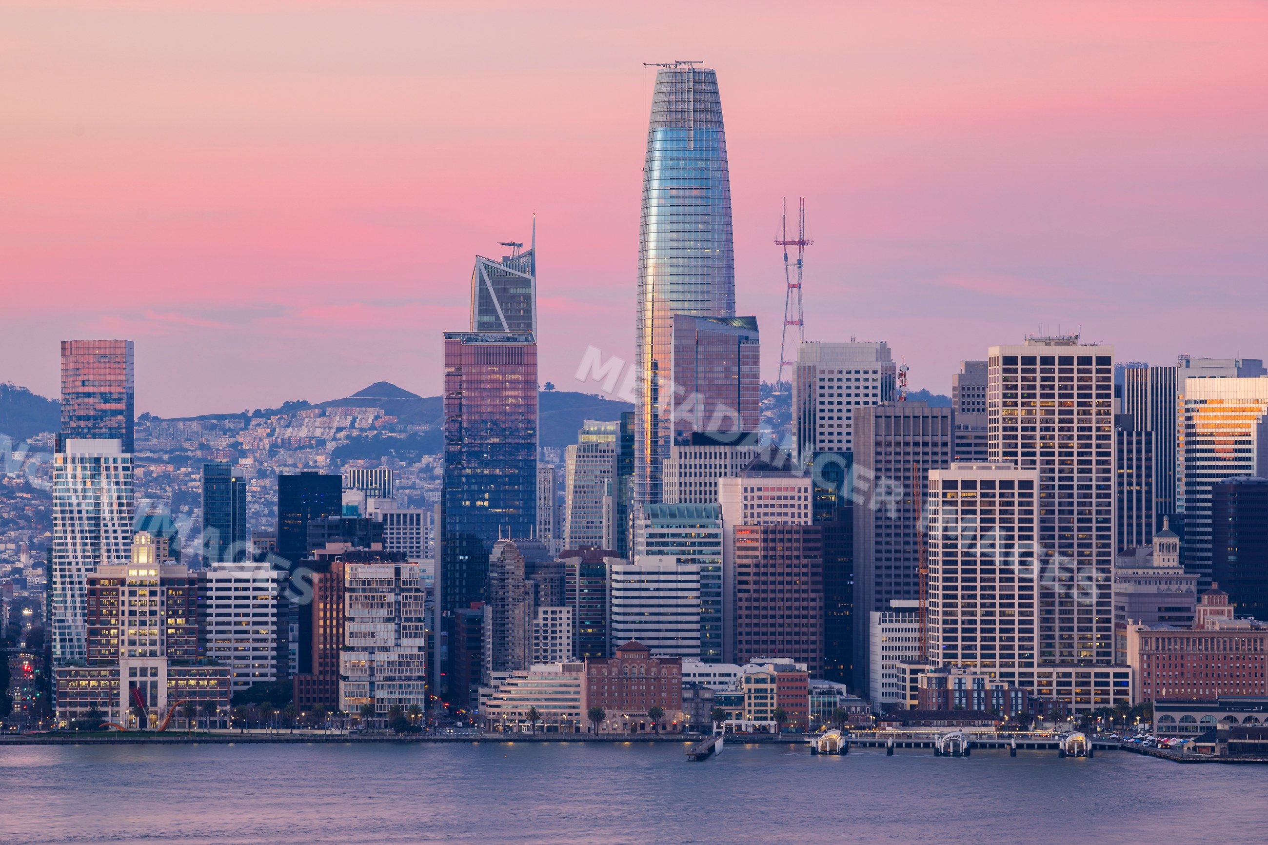 San Francisco Downtown skyline at sunset with pink sky over the bay