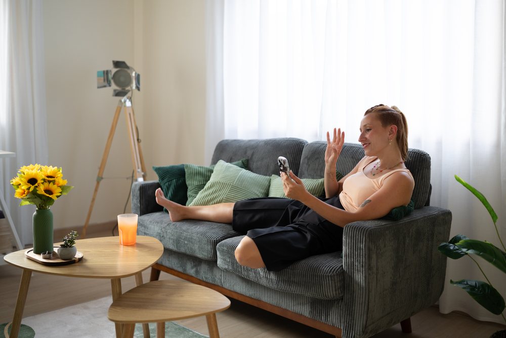 White Woman waving during a video call