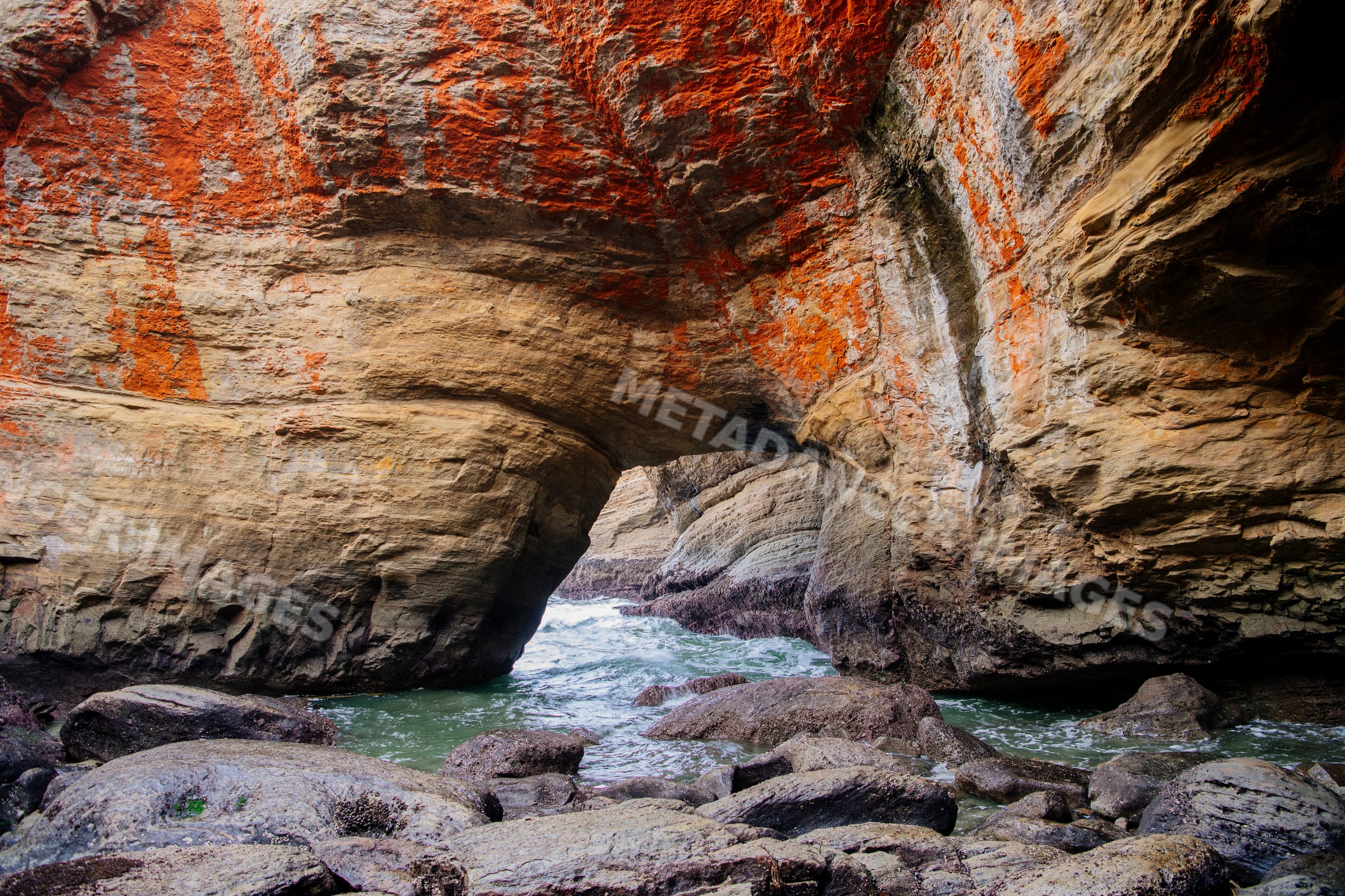 Rock arch formation at devils punch bowl along Oregon coastline
