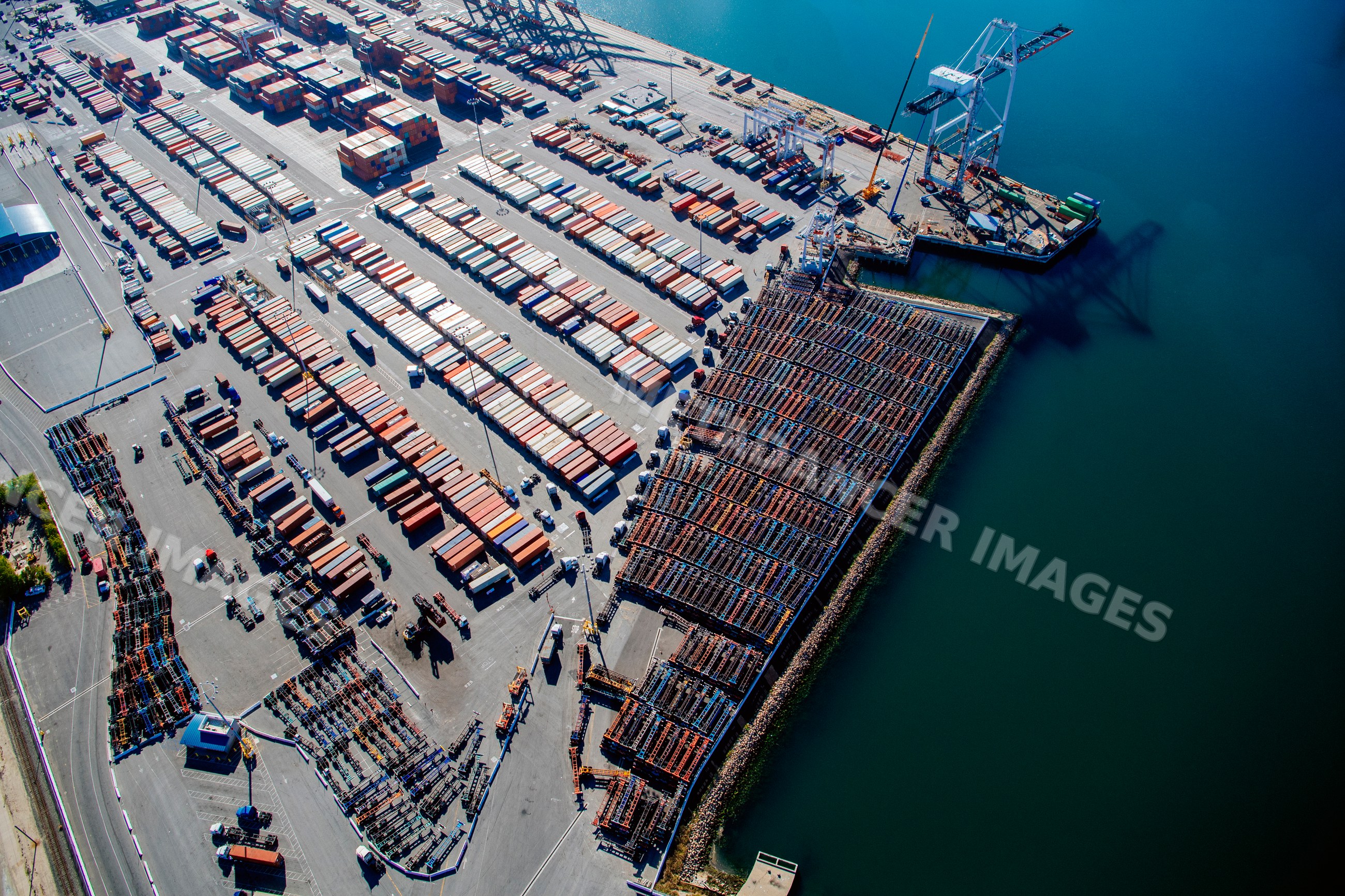Shipping container stacks and cranes at port in long beach