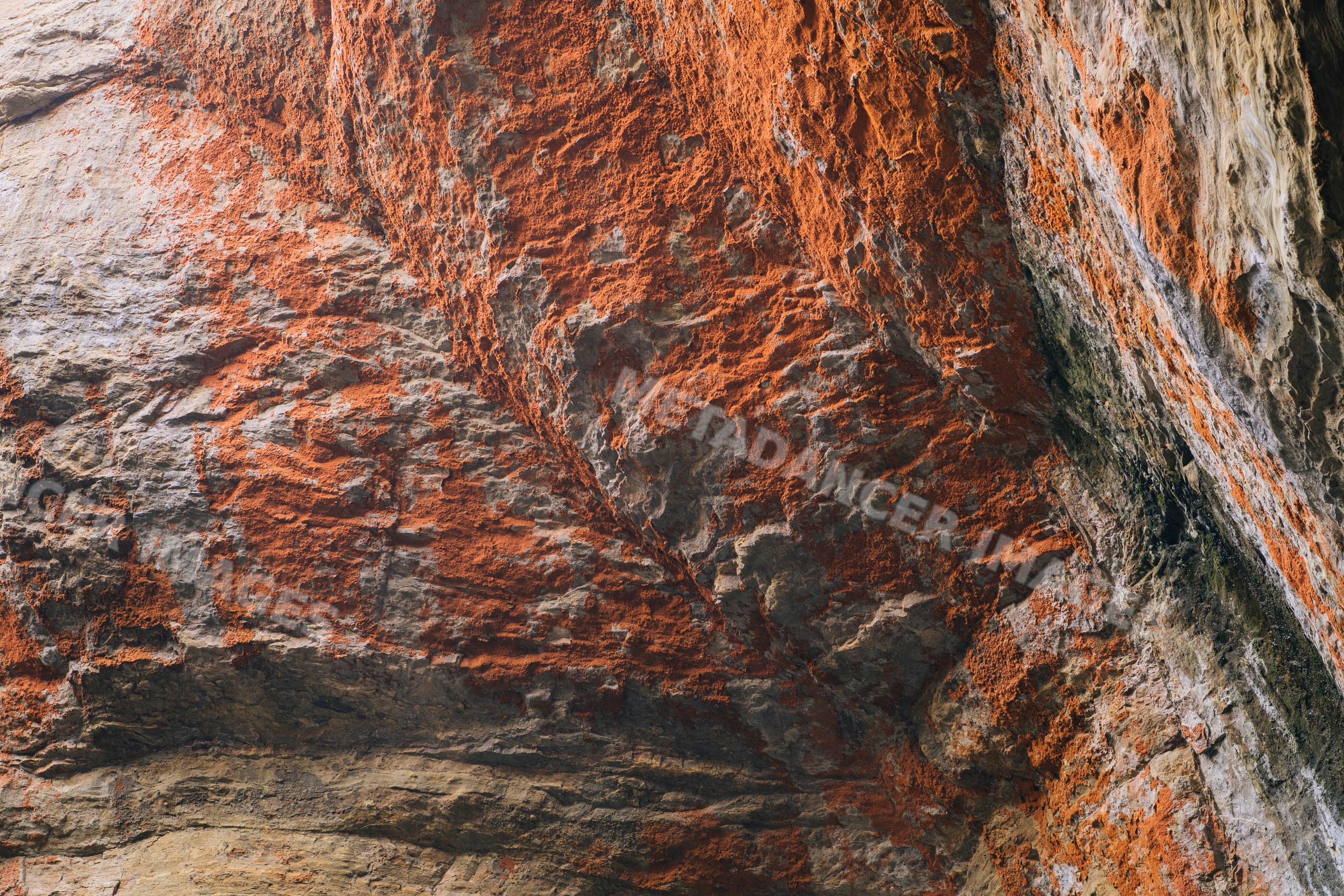Devils punch bowl rock formation with orange lichen