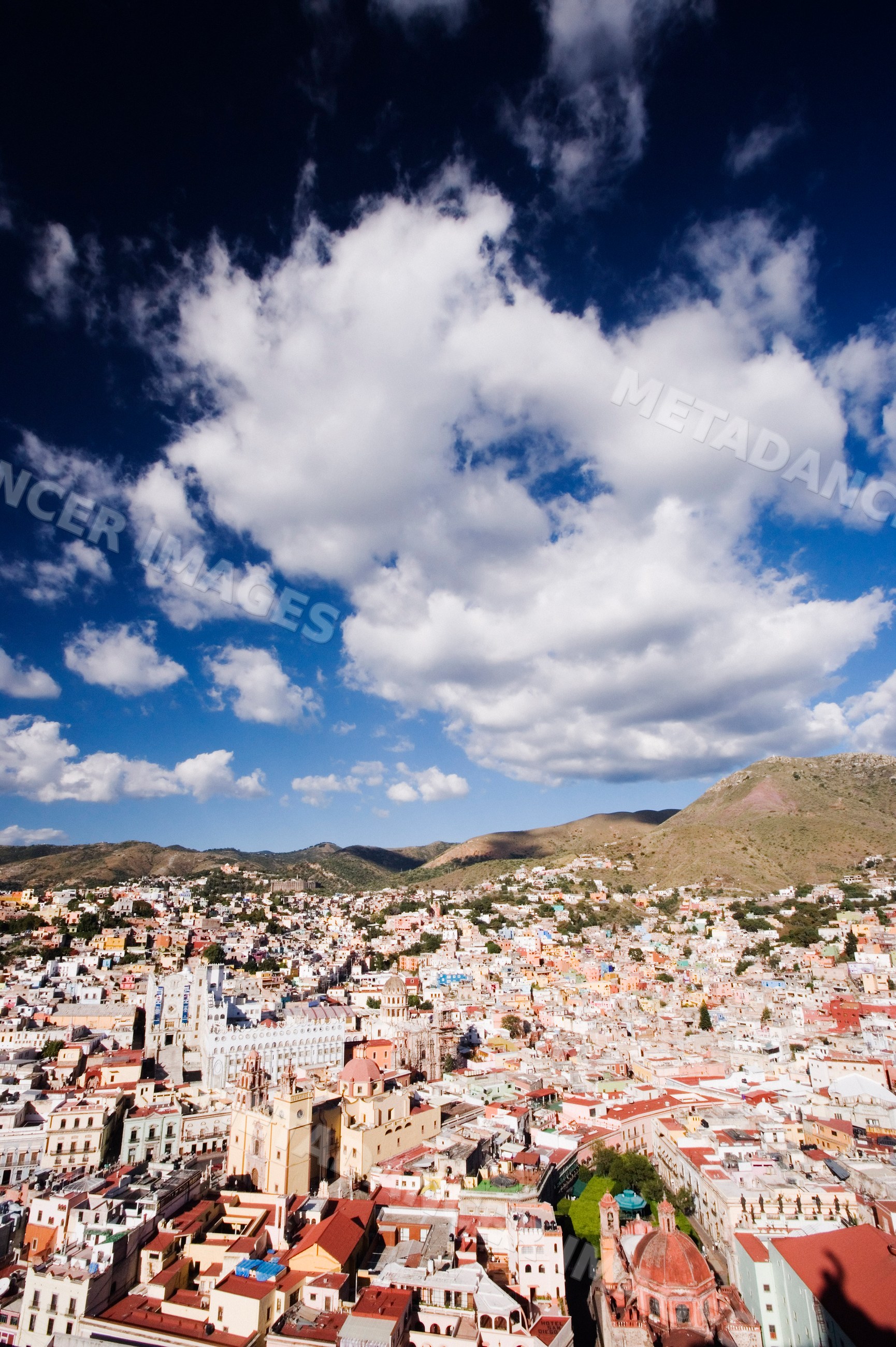 Guanajuato cityscape with colorful buildings and cloudy sky