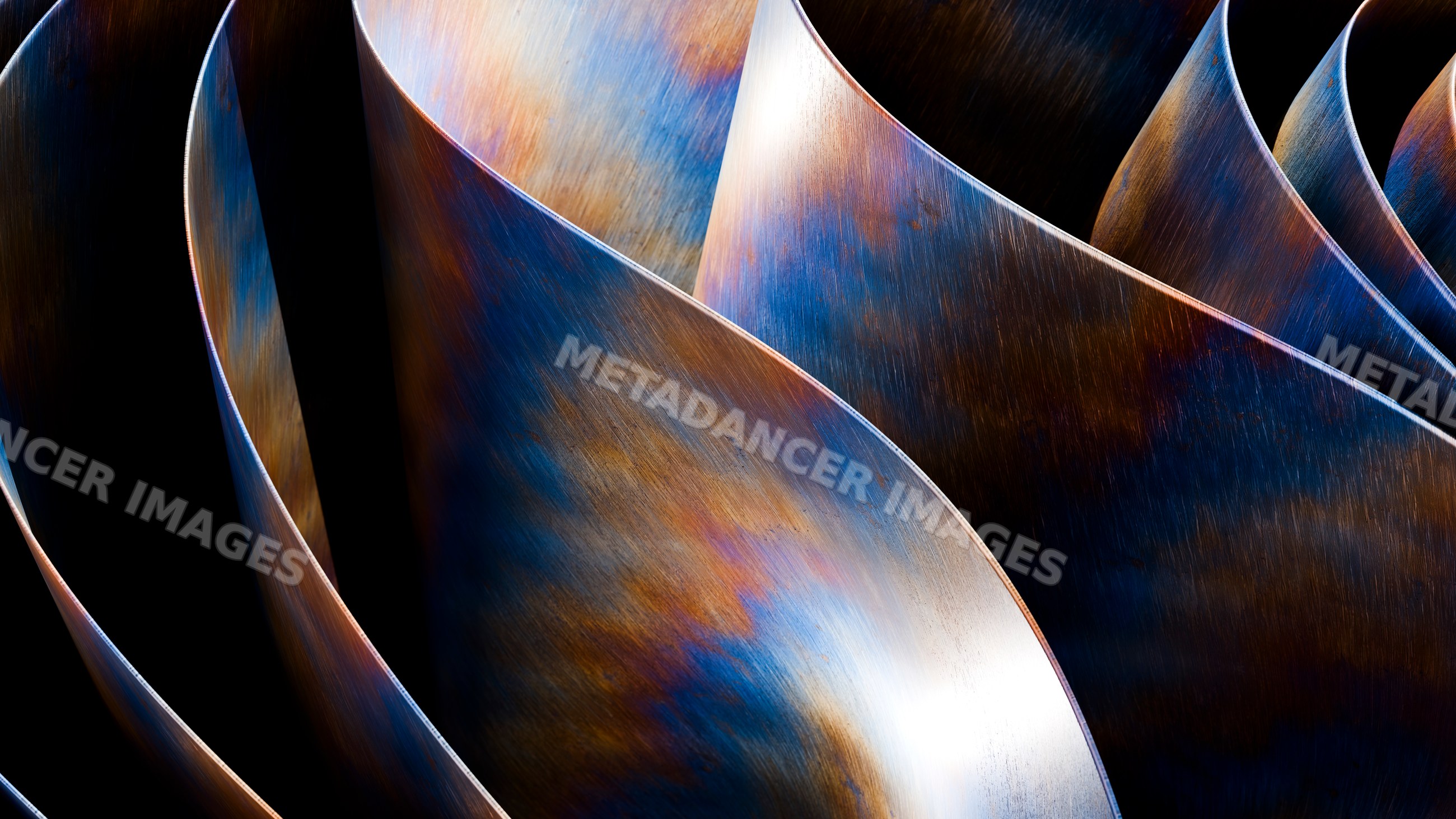 Curved metal sculpture with colorful blue and orange patina detail