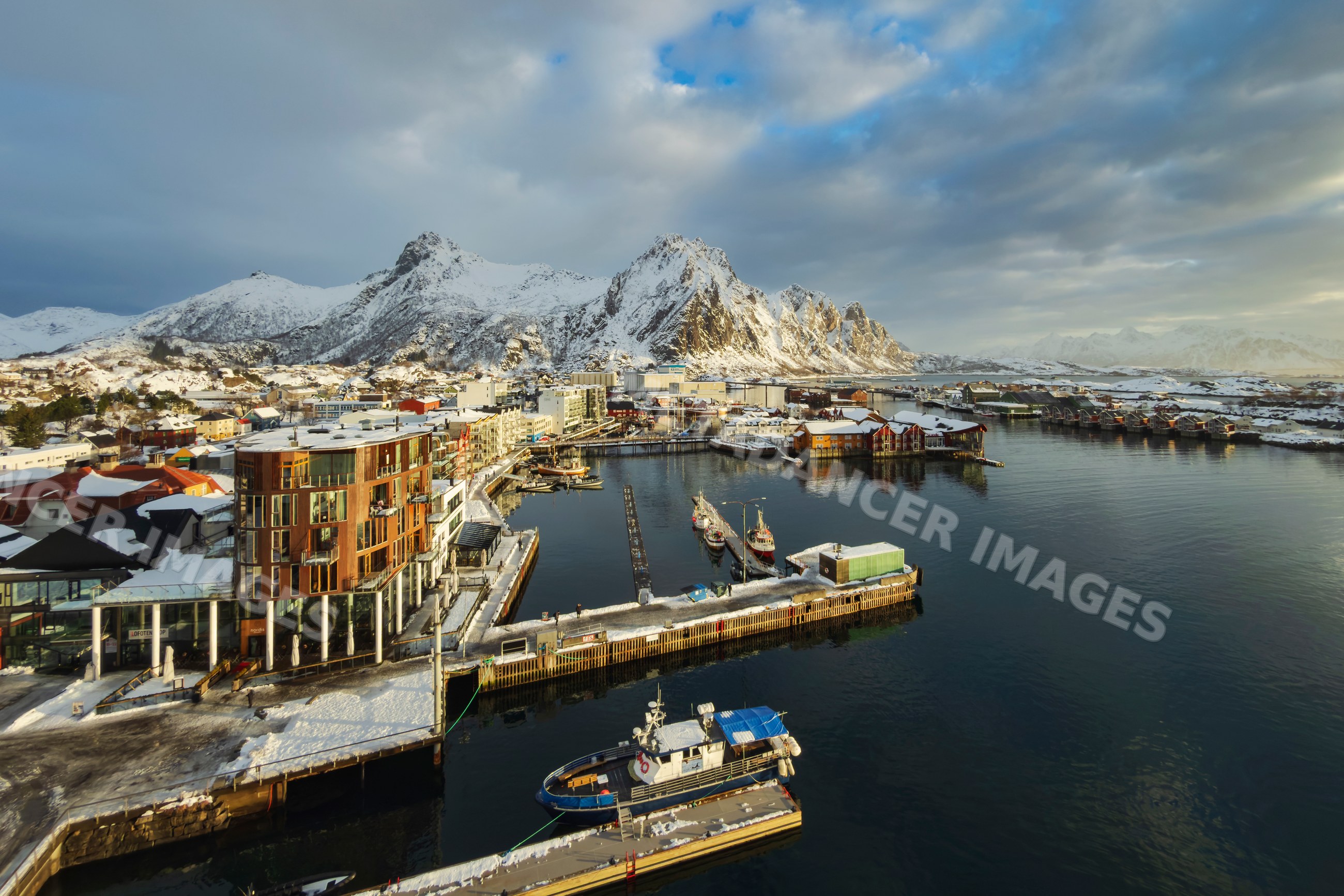 Port and snow-covered Goat Mountain at Sunrise in svolvaer, Norway