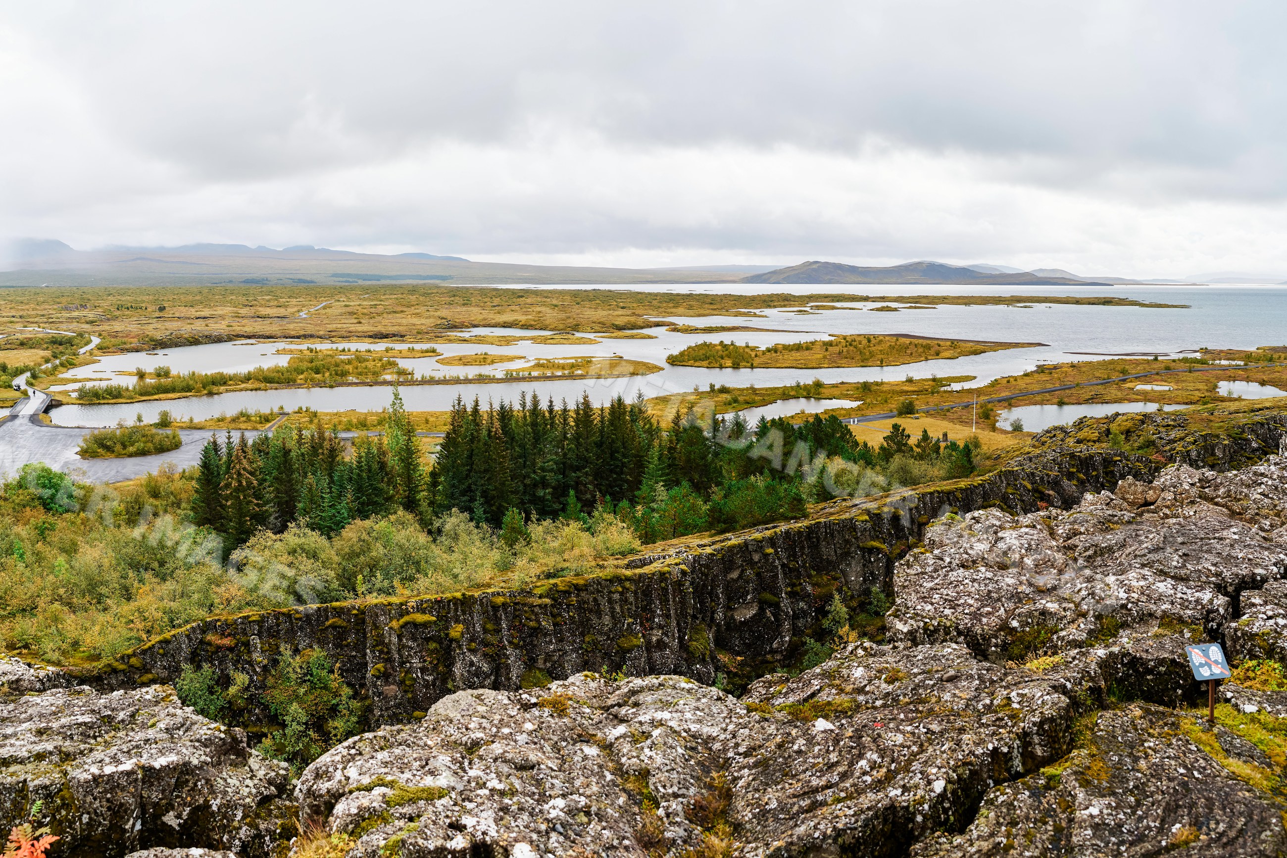 Scenic volcanic landscape with river islands and forest