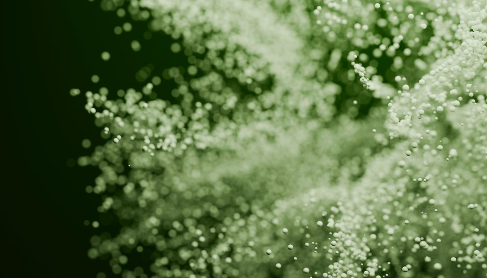 Green floating sphere particles in abstract background