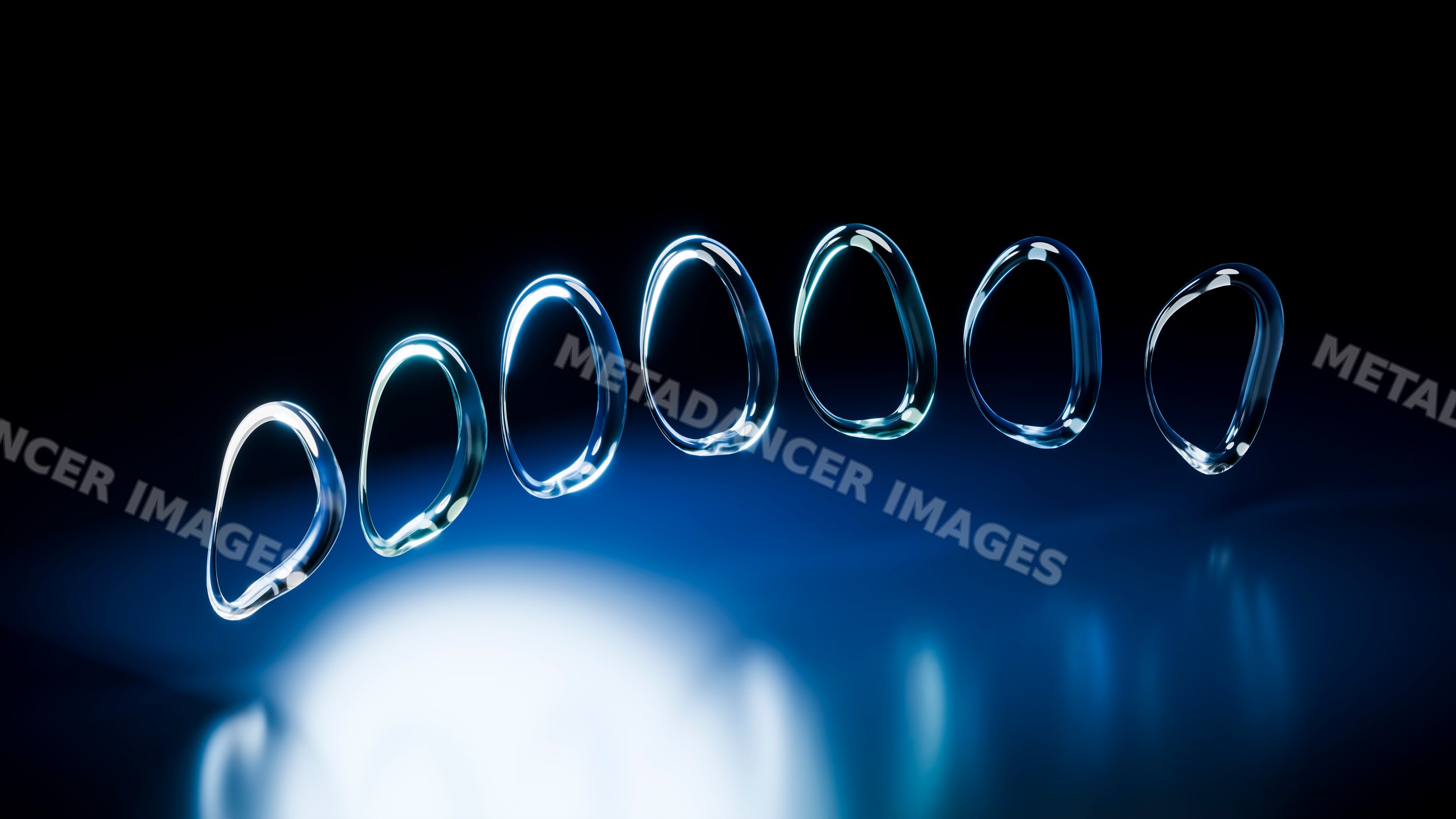 Blue-lit water droplets reflected on black background