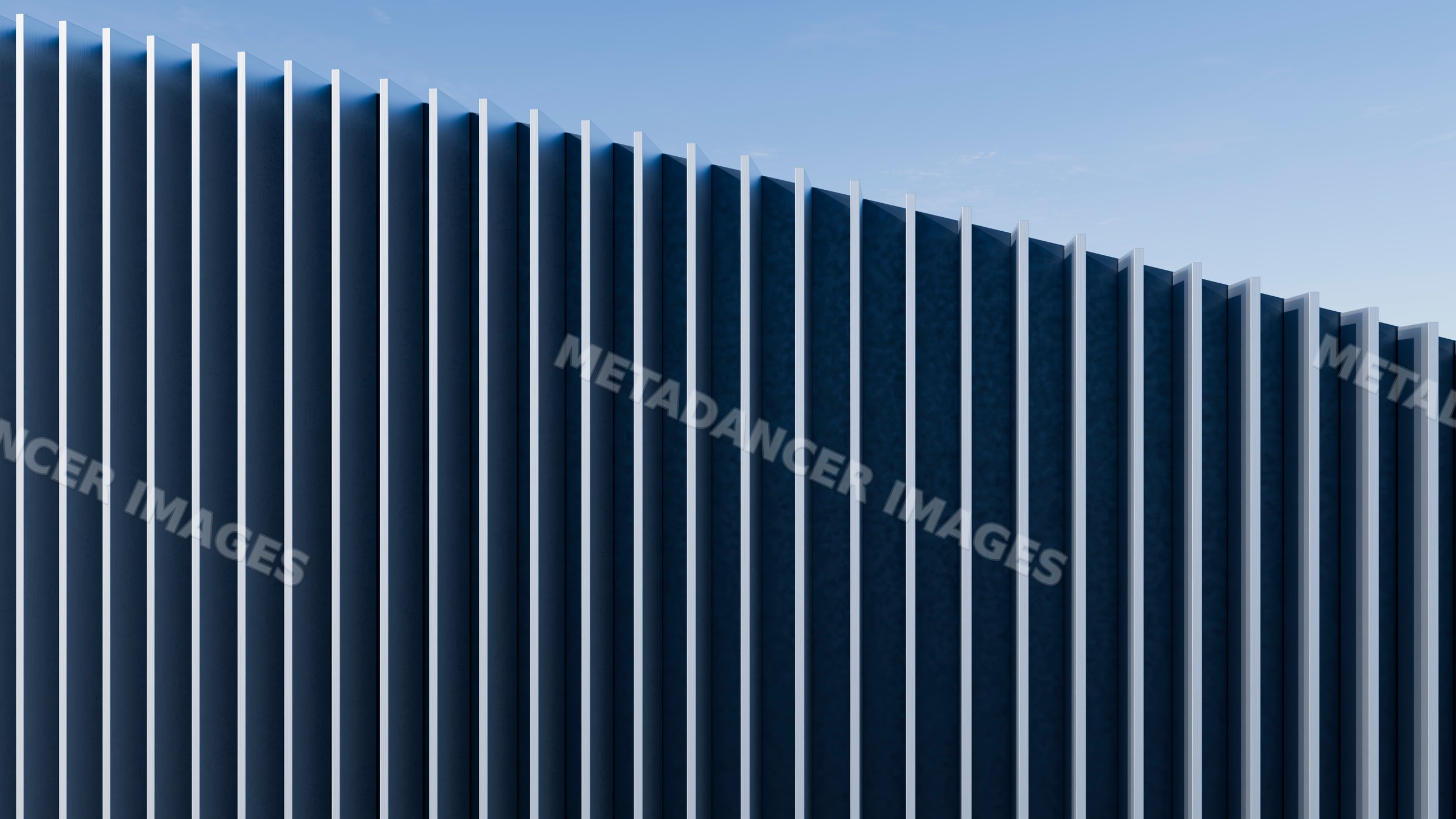 Modern building facade with vertical fins casting dramatic shadows