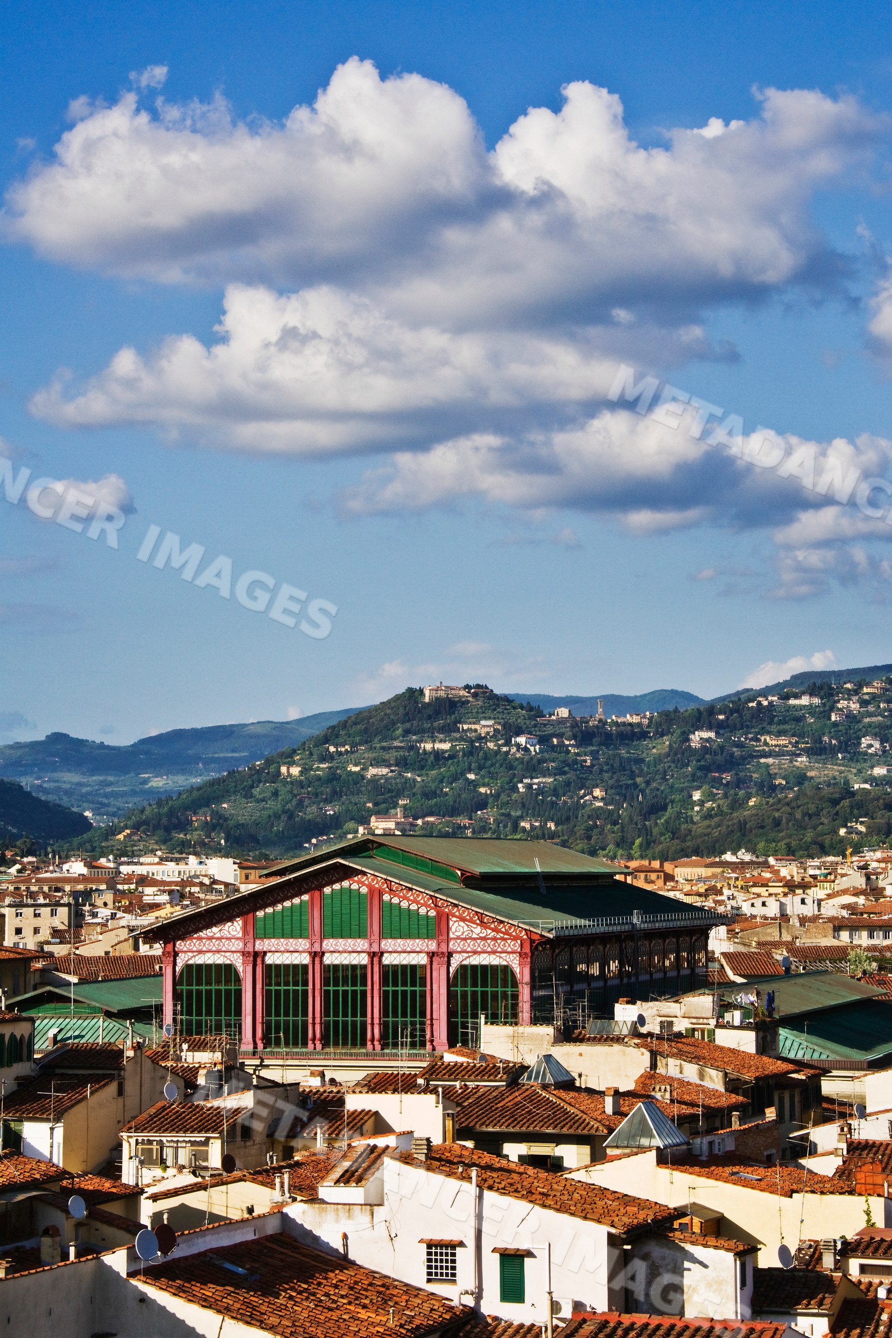 Mercato centrale market building with florence rooftops and hills