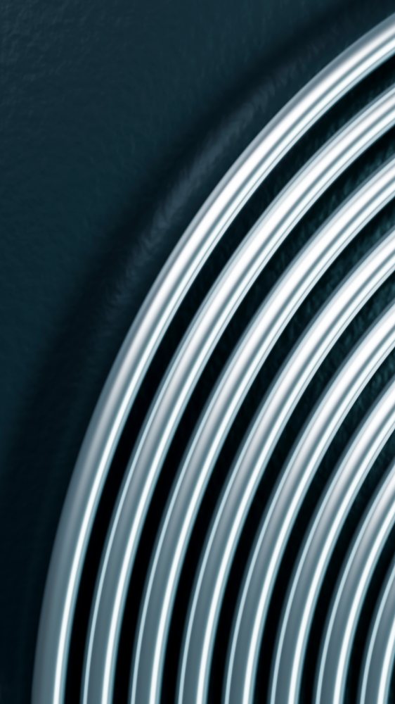 Close-up of overlapping silver metal rings creating circular abstract