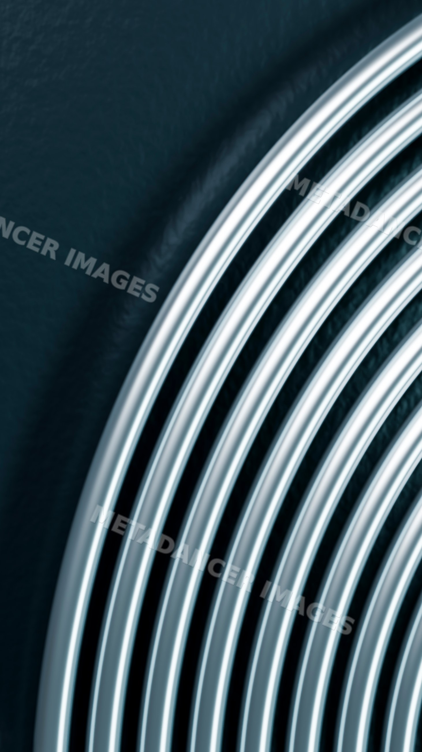 Close-up of overlapping silver metal rings creating circular abstract
