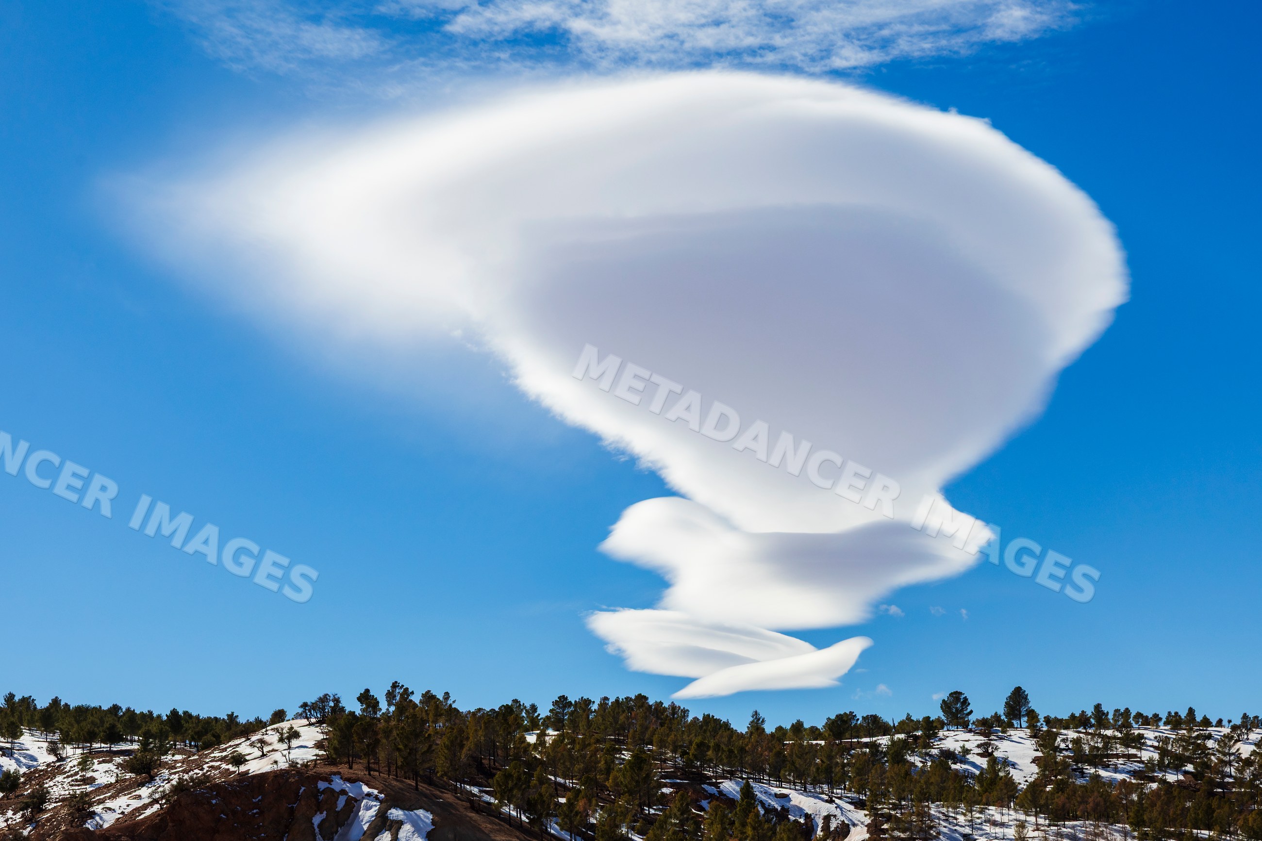 Lenticular Cloud over snow-covered High Atlas Mountains