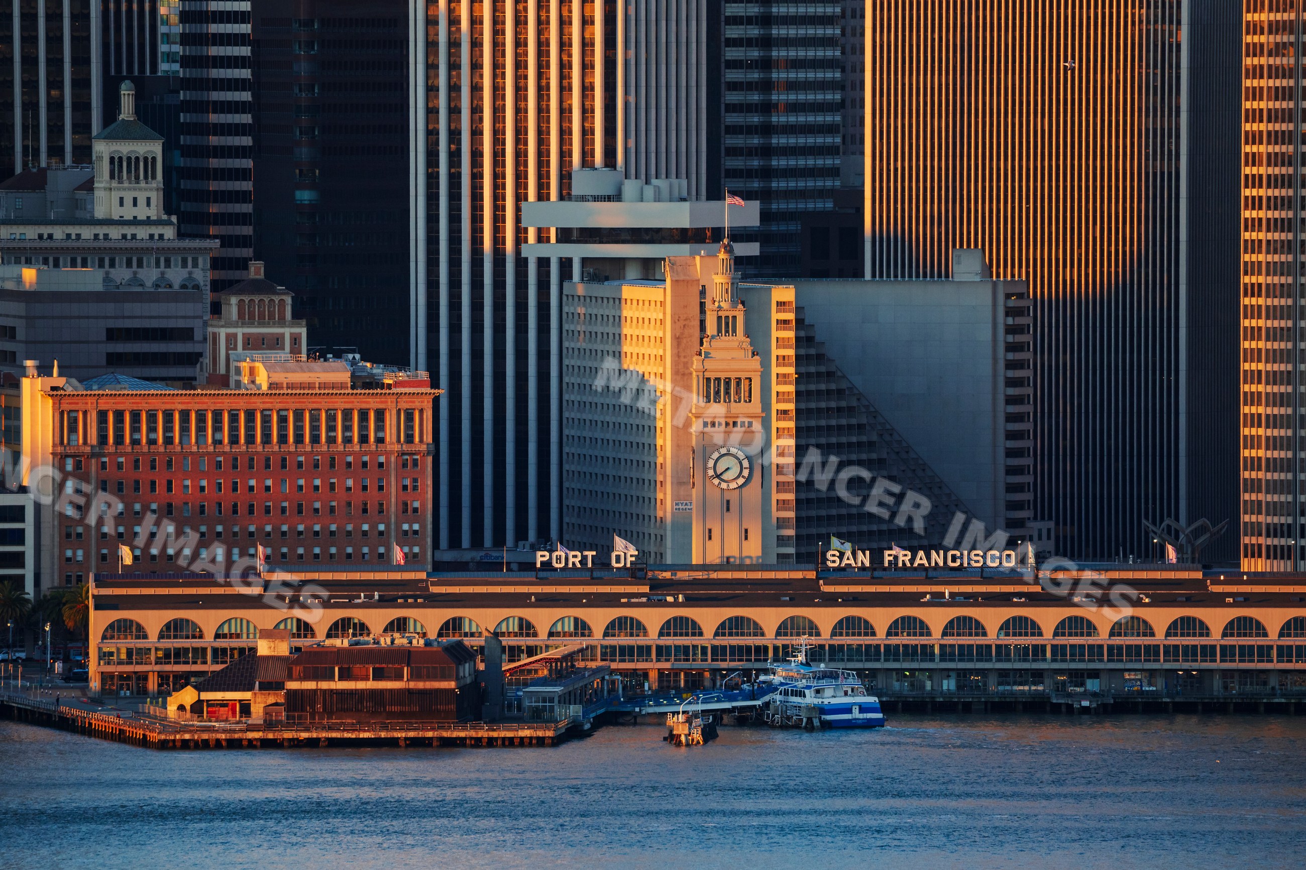 Port of San Francisco waterfront with clock tower and ferry boat