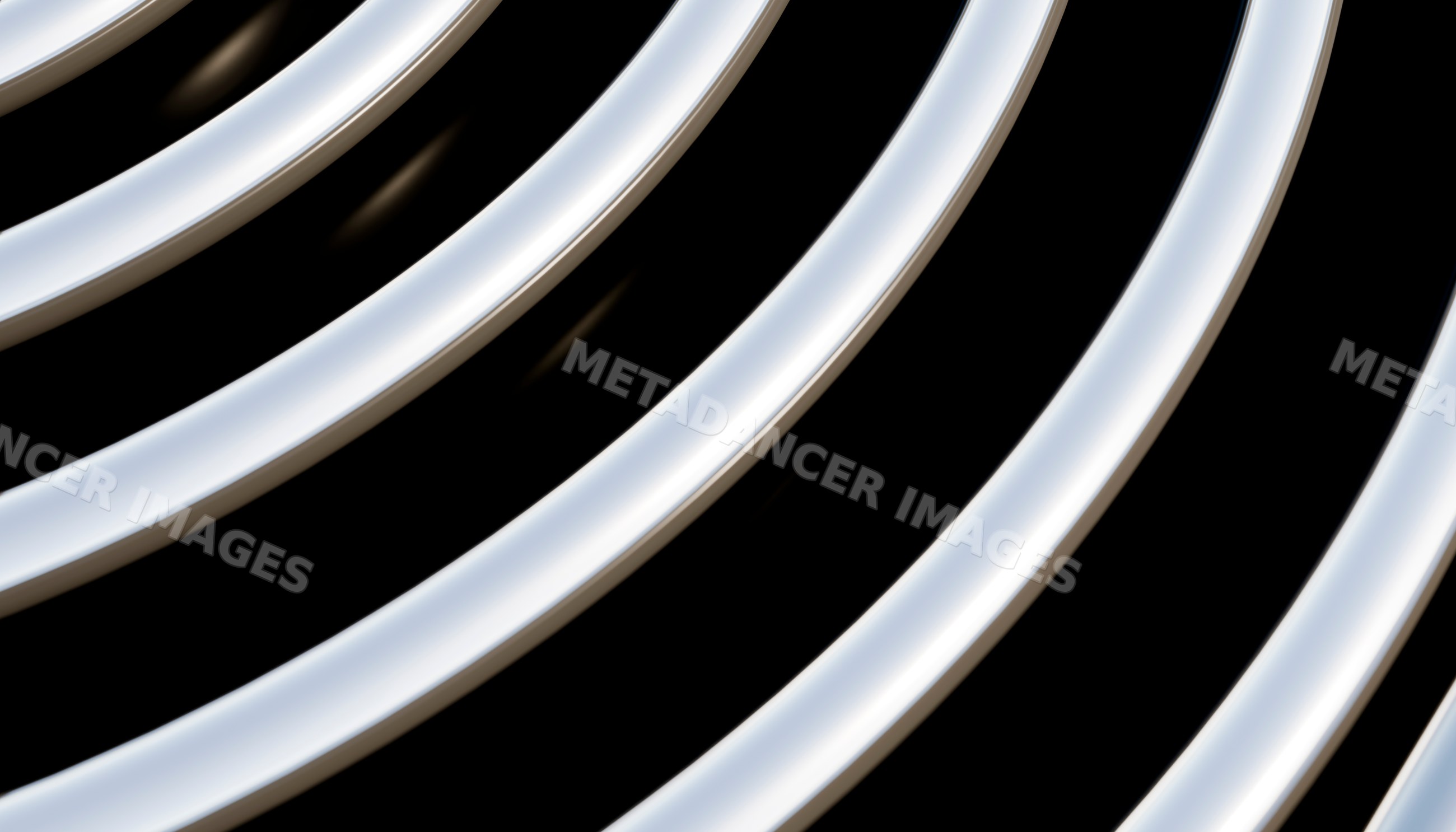 Close-up view of curved shiny metal tubes arranged in parallel lines