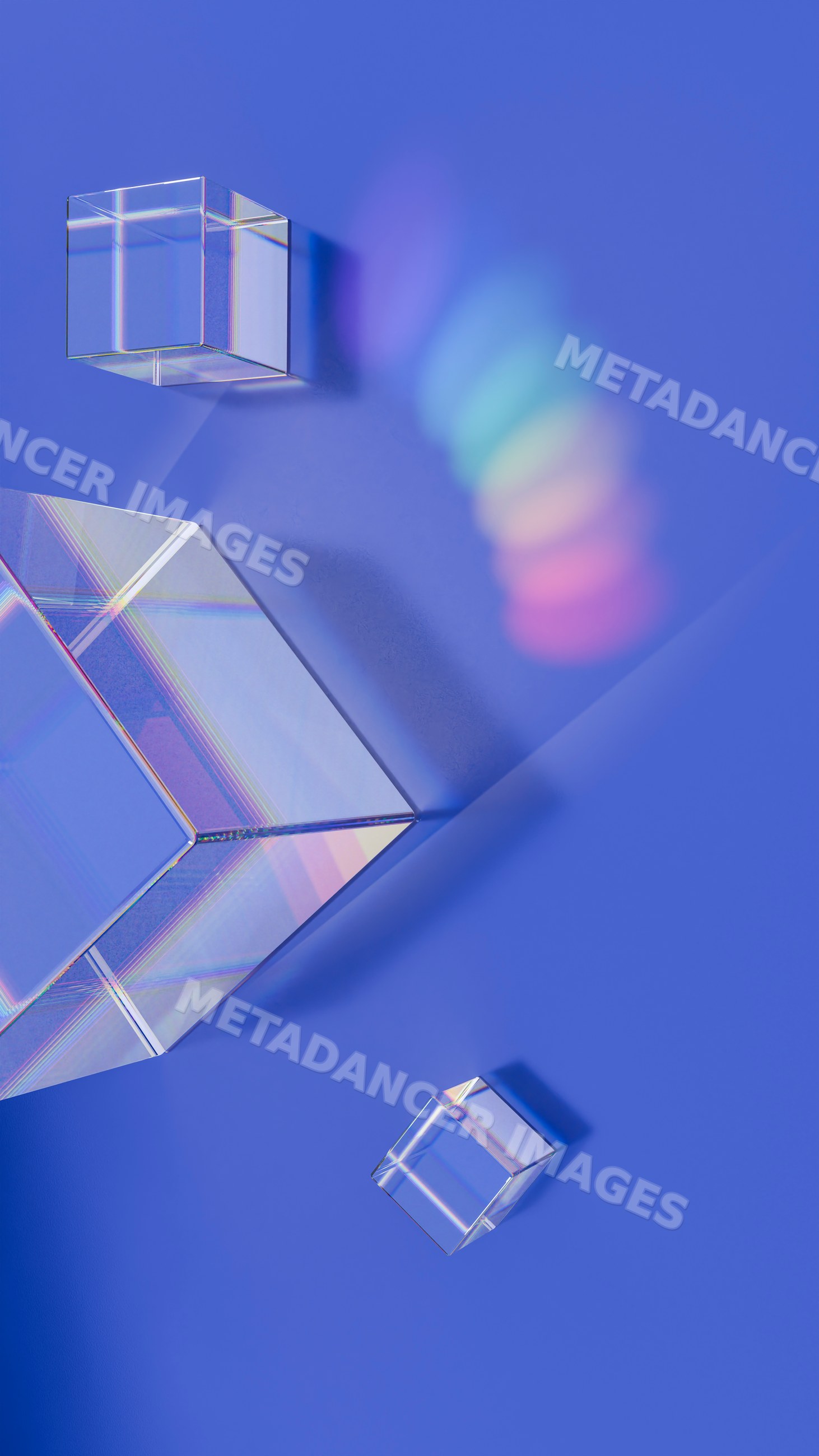 Prism-shaped crystal cubes casting rainbow light on blue background