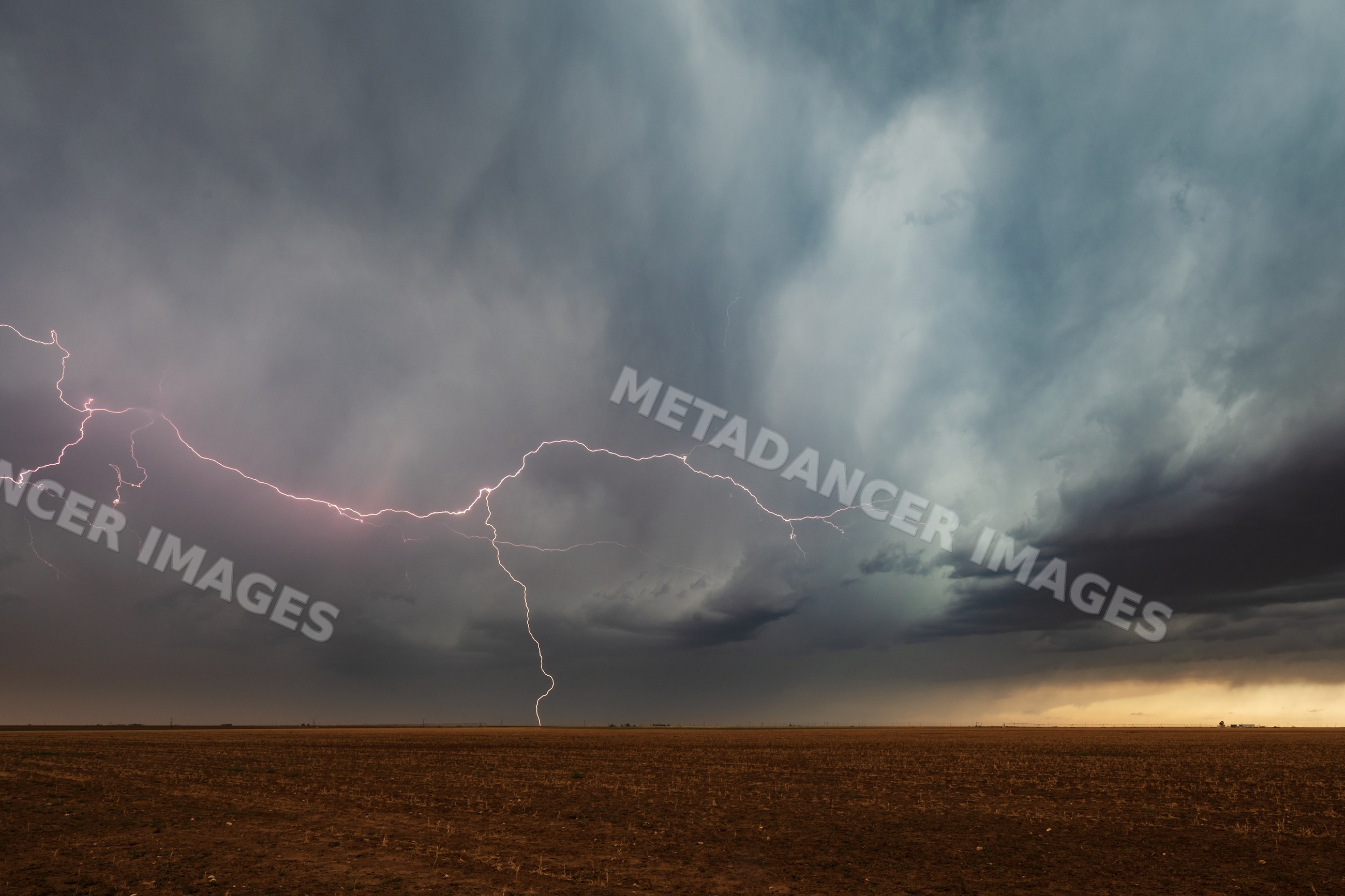 Lightning strike over stormy field in floydada texas
