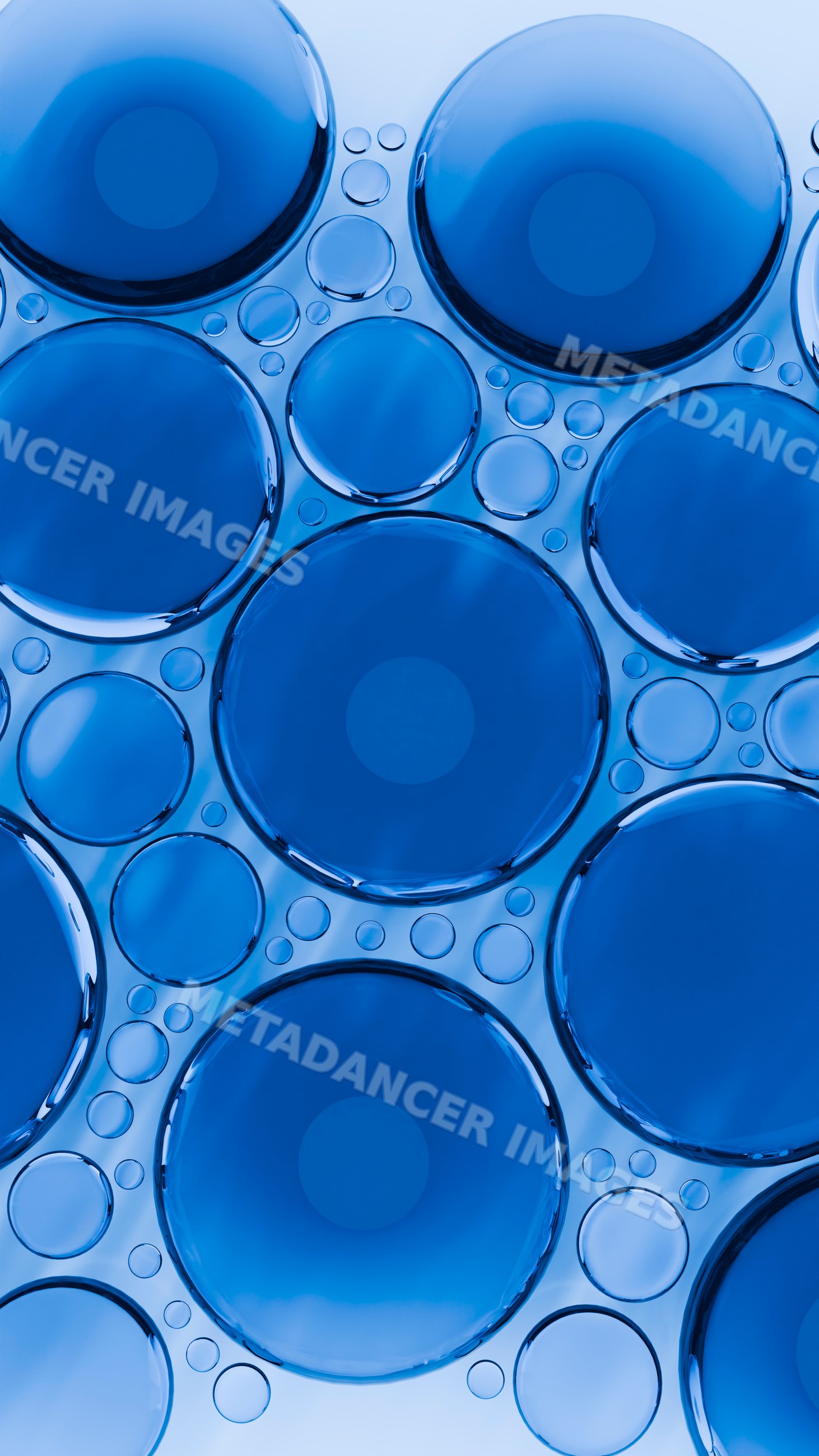 Blue liquid bubbles macro close-up with abstract circular patterns