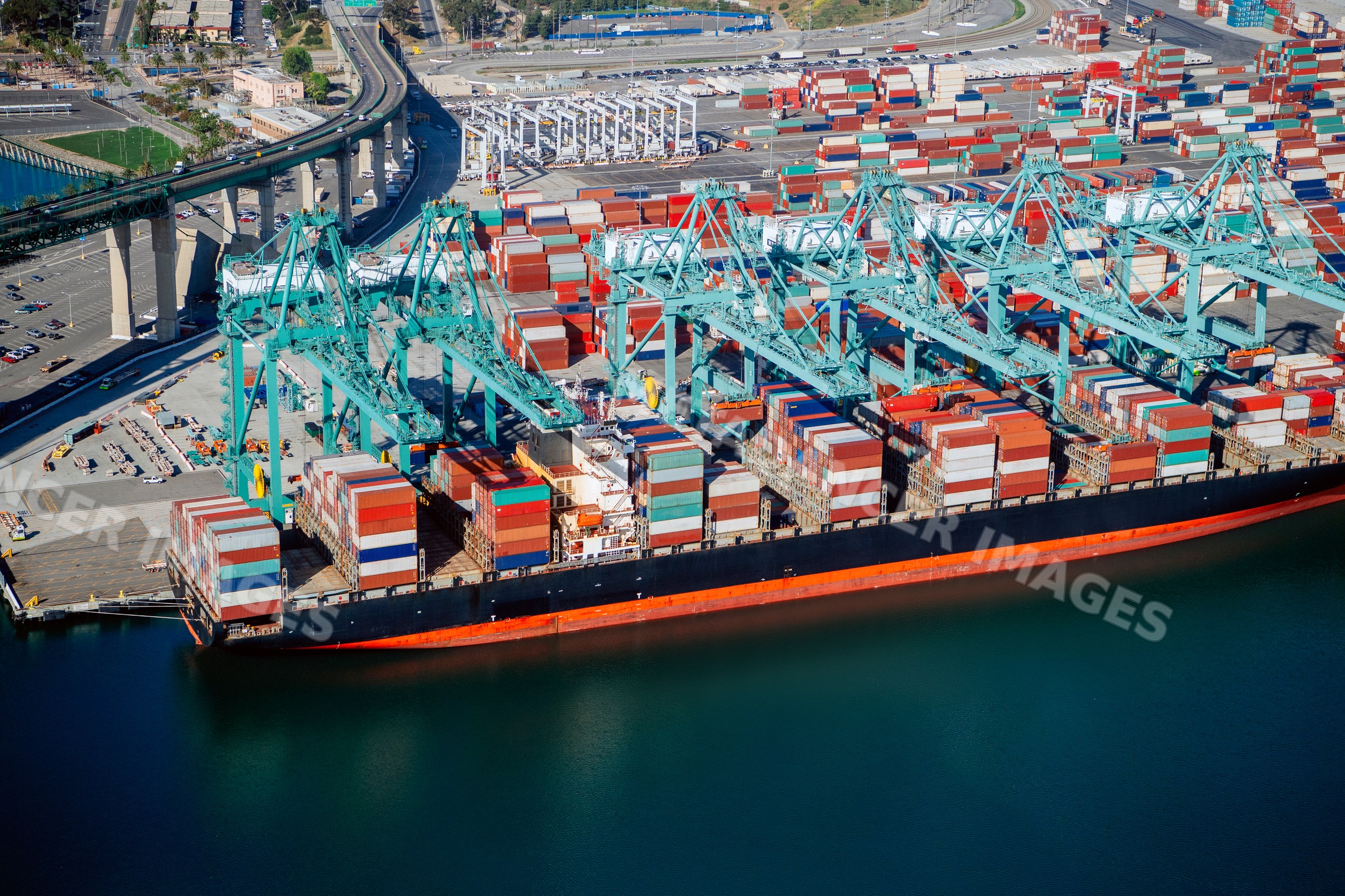 Container ship loaded with cargo containers in a beach