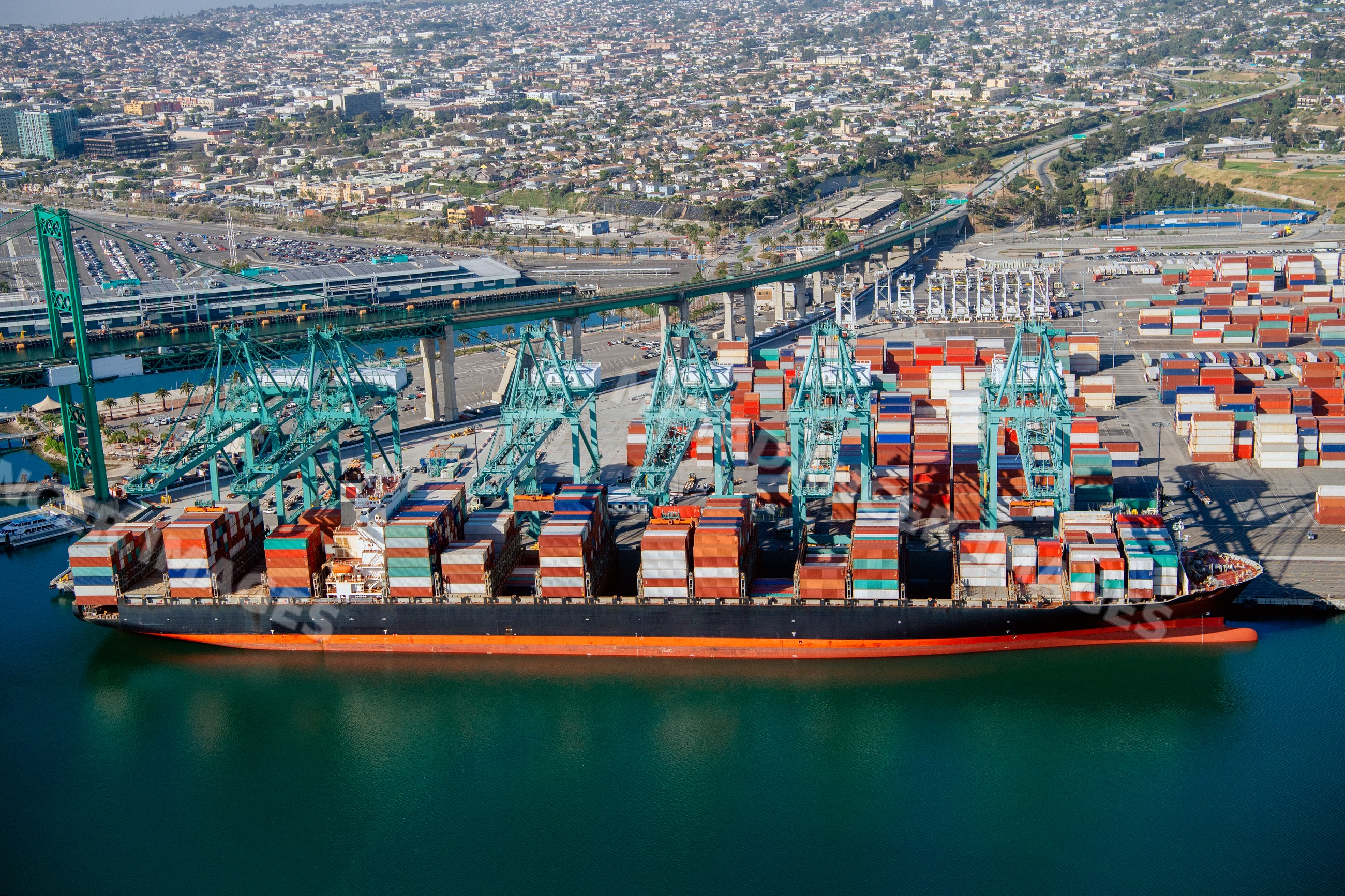 Container ship loaded with cargo containers in a beach