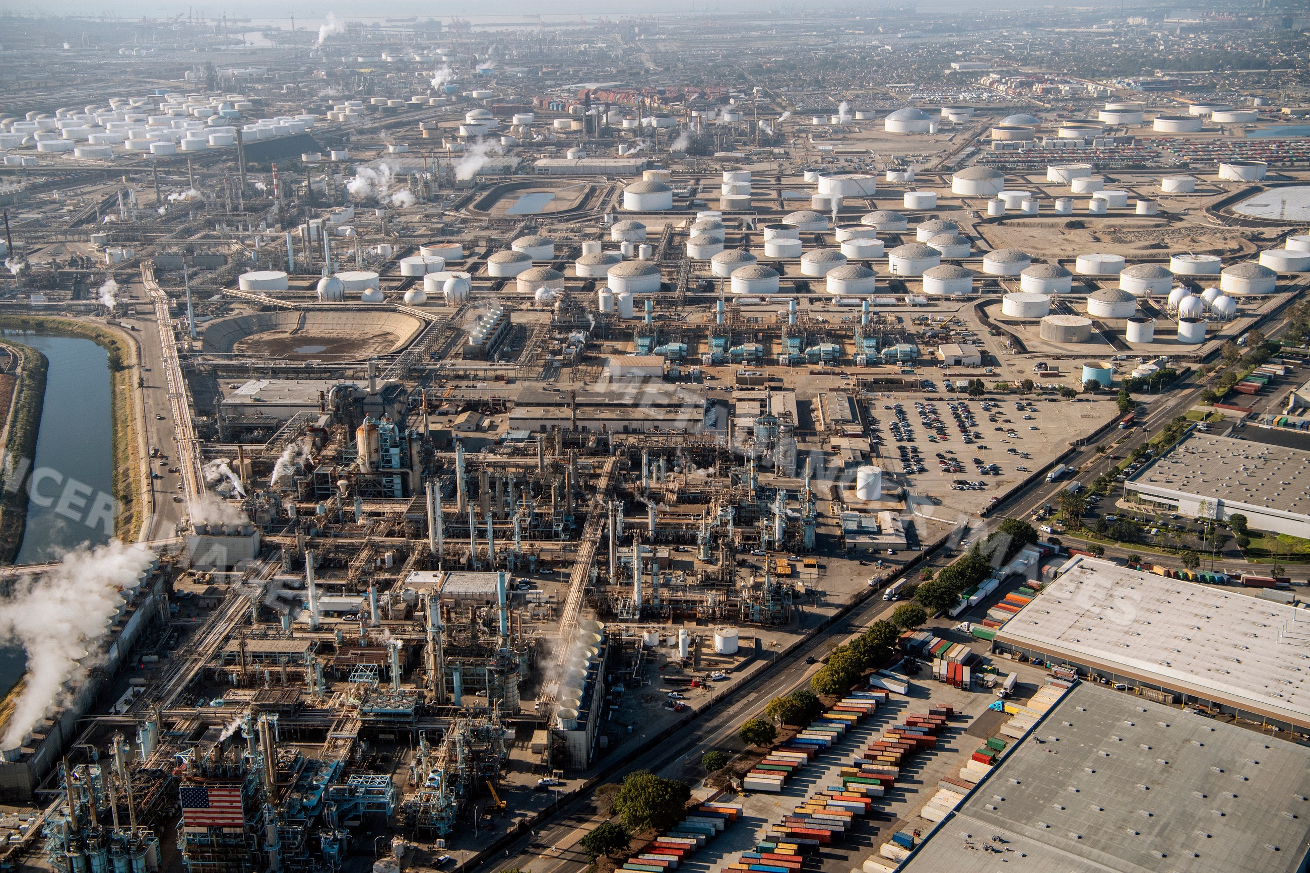 Oil refinery and fuel storage tanks in a beach