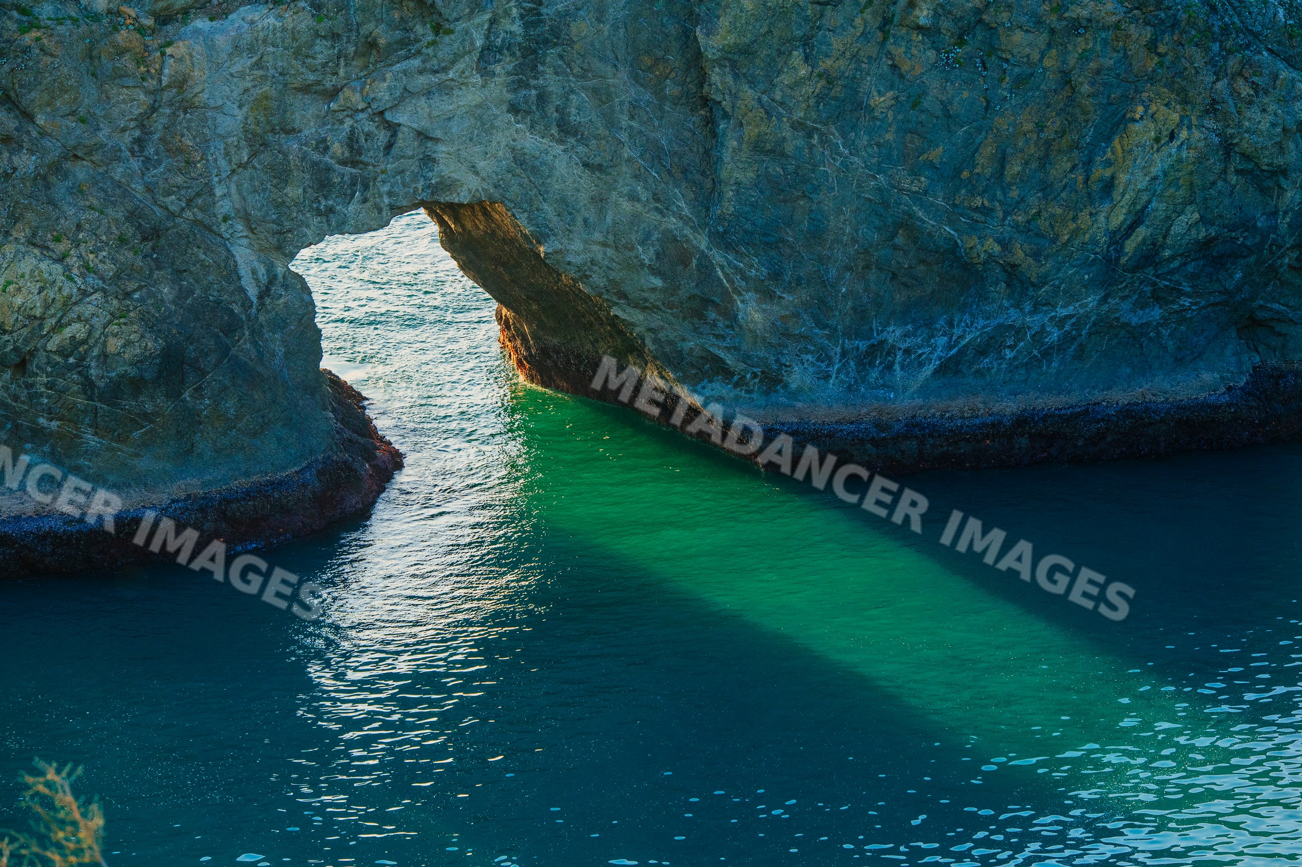 Natural rock arch formation over ocean Oregon