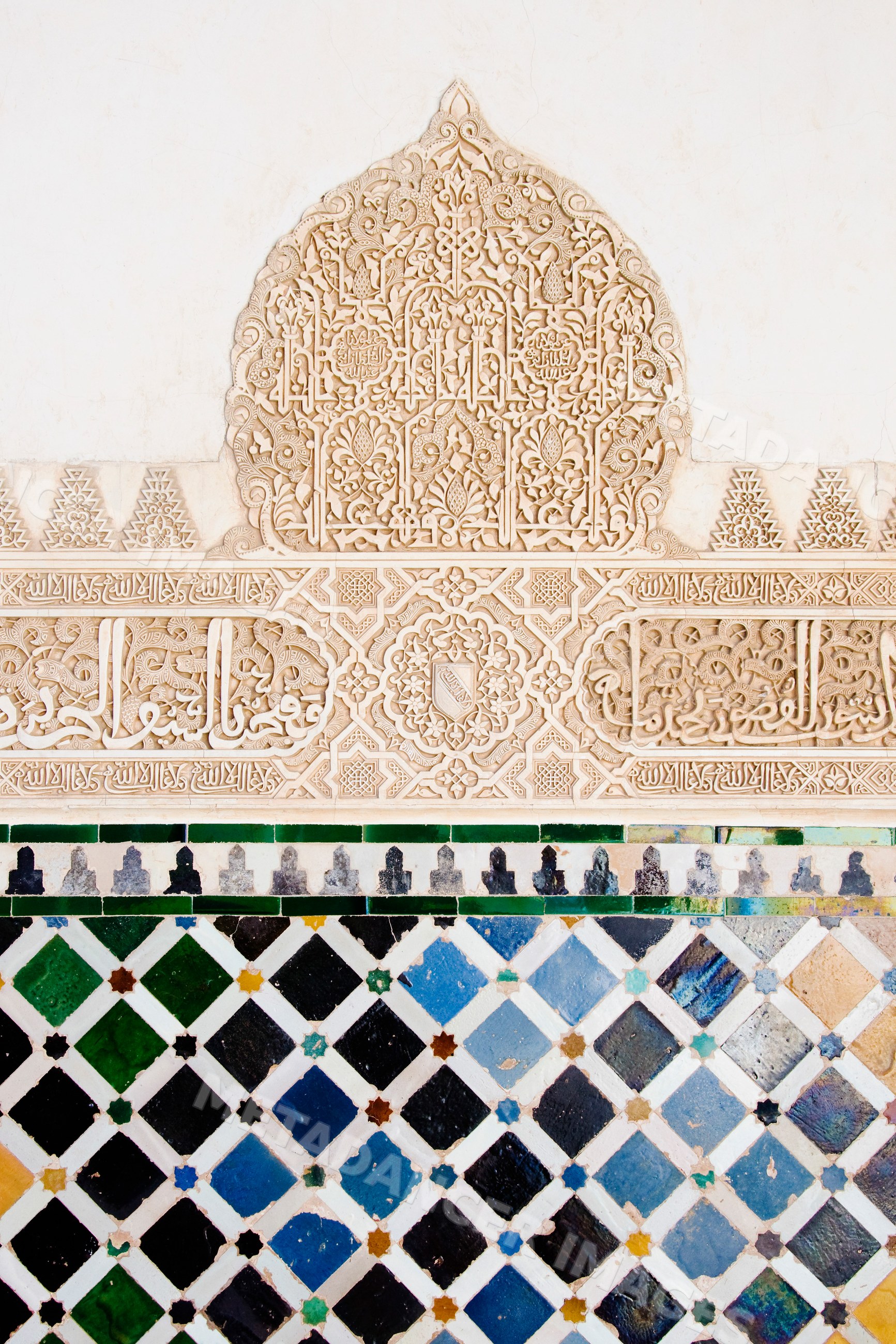 Moorish carving and tilework detail at alhambra palace in granada