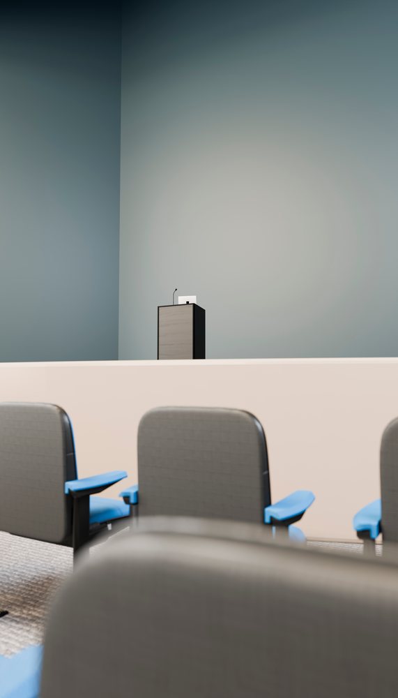 Lecture hall podium with microphone and seating in conference room