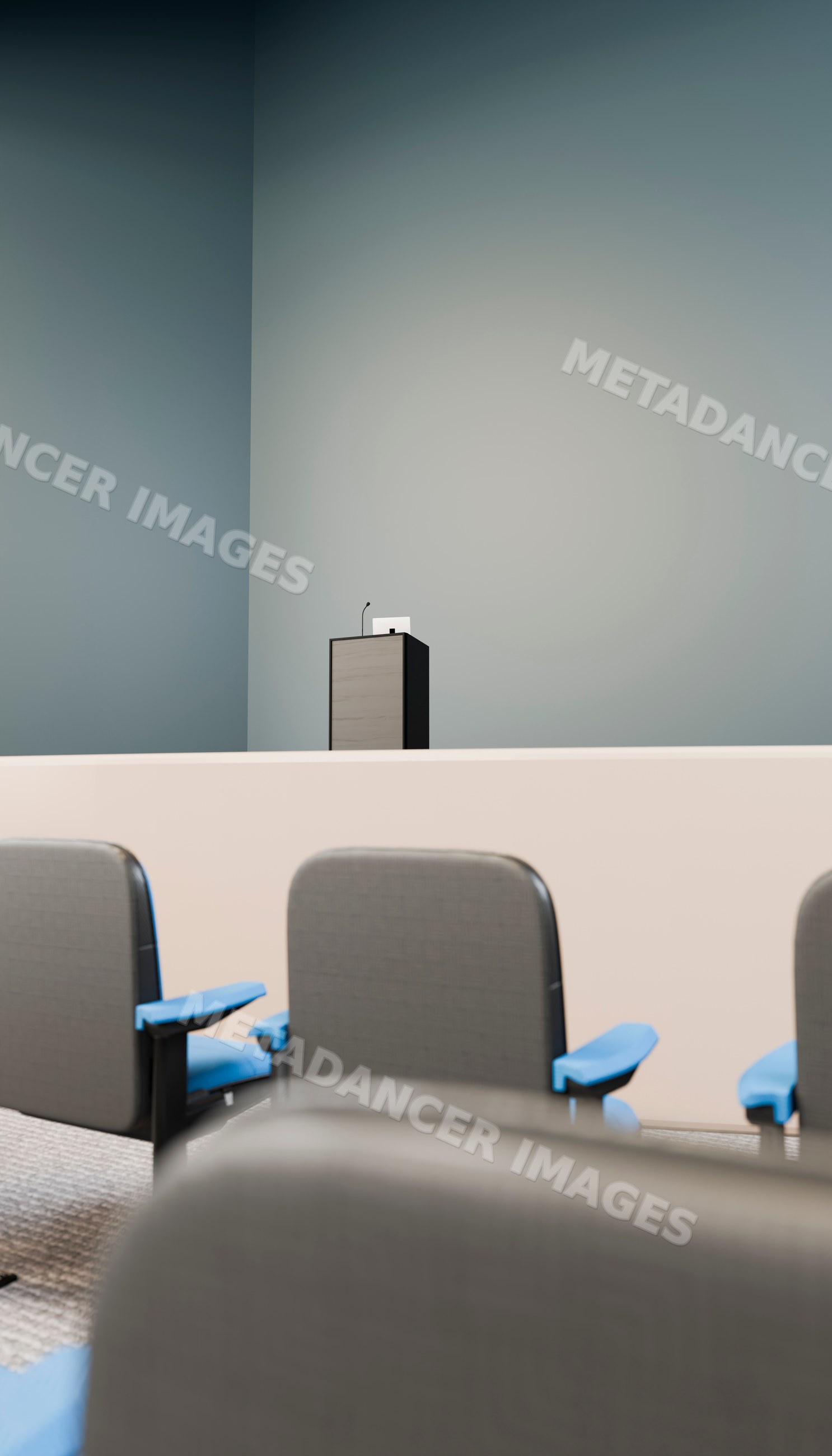 Lecture hall podium with microphone and seating in conference room