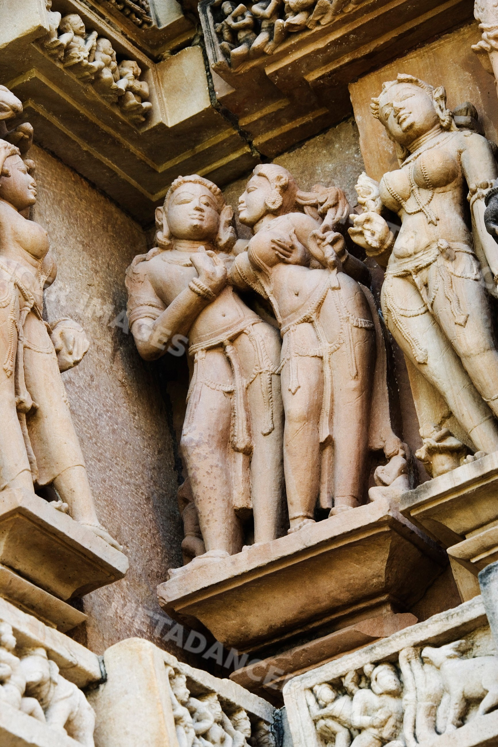 Erotic stone sculptures on khajuraho temple walls