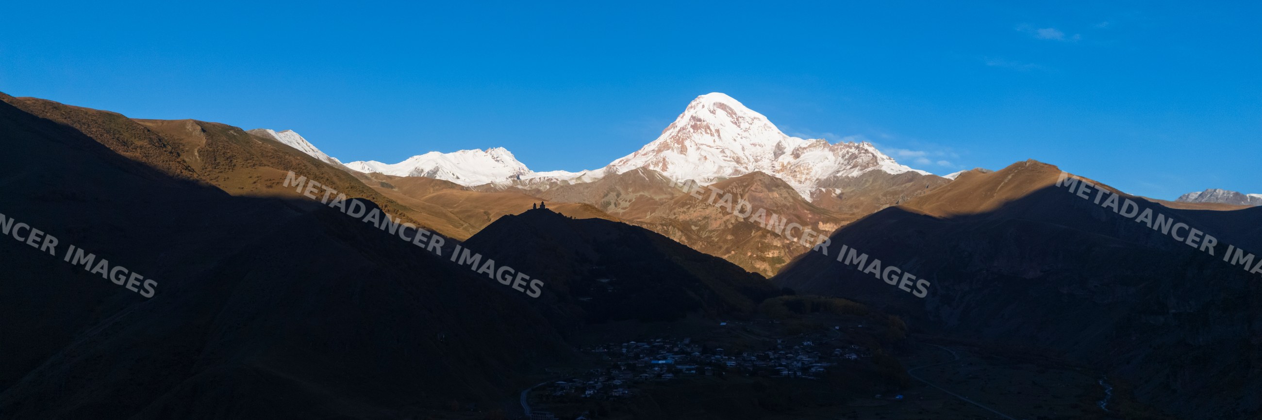 Gergeti Trinity Church and Mount Kazbegi in a church