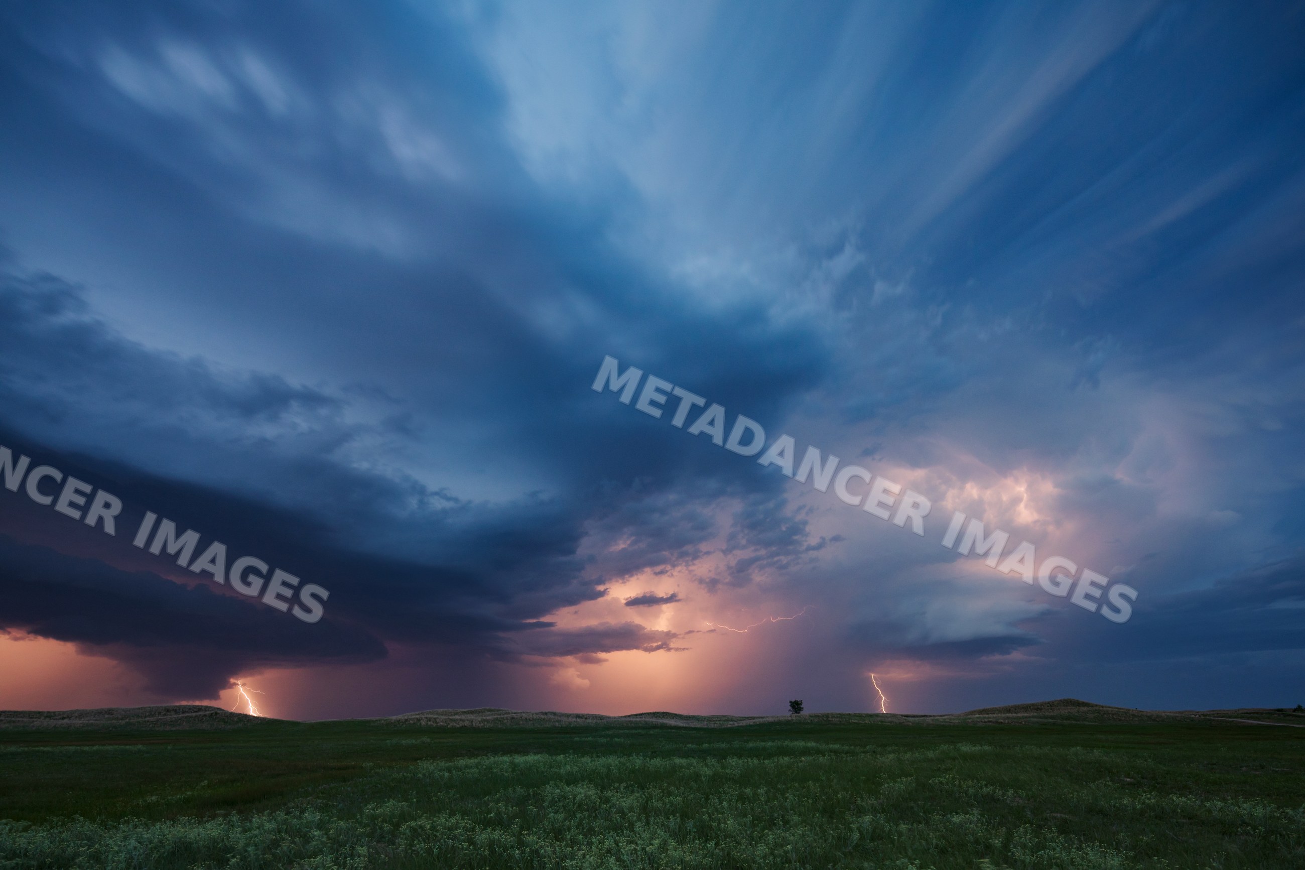 Storm clouds with lightning over fields in dunning nebraska