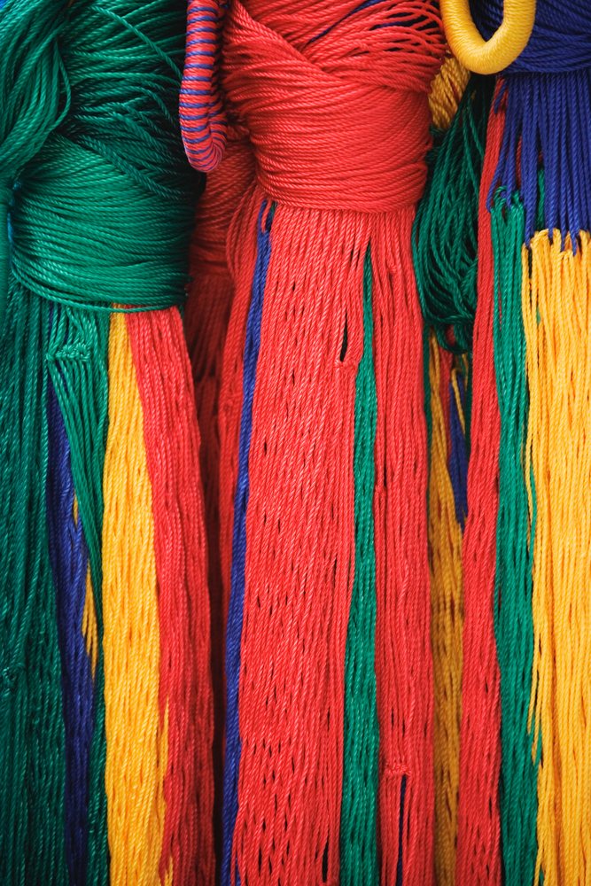 Colorful hanging strings creating vibrant fiber texture, mexico