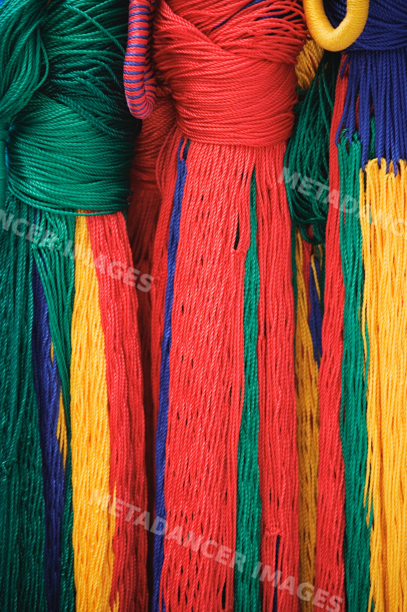 Colorful hanging strings creating vibrant fiber texture, mexico