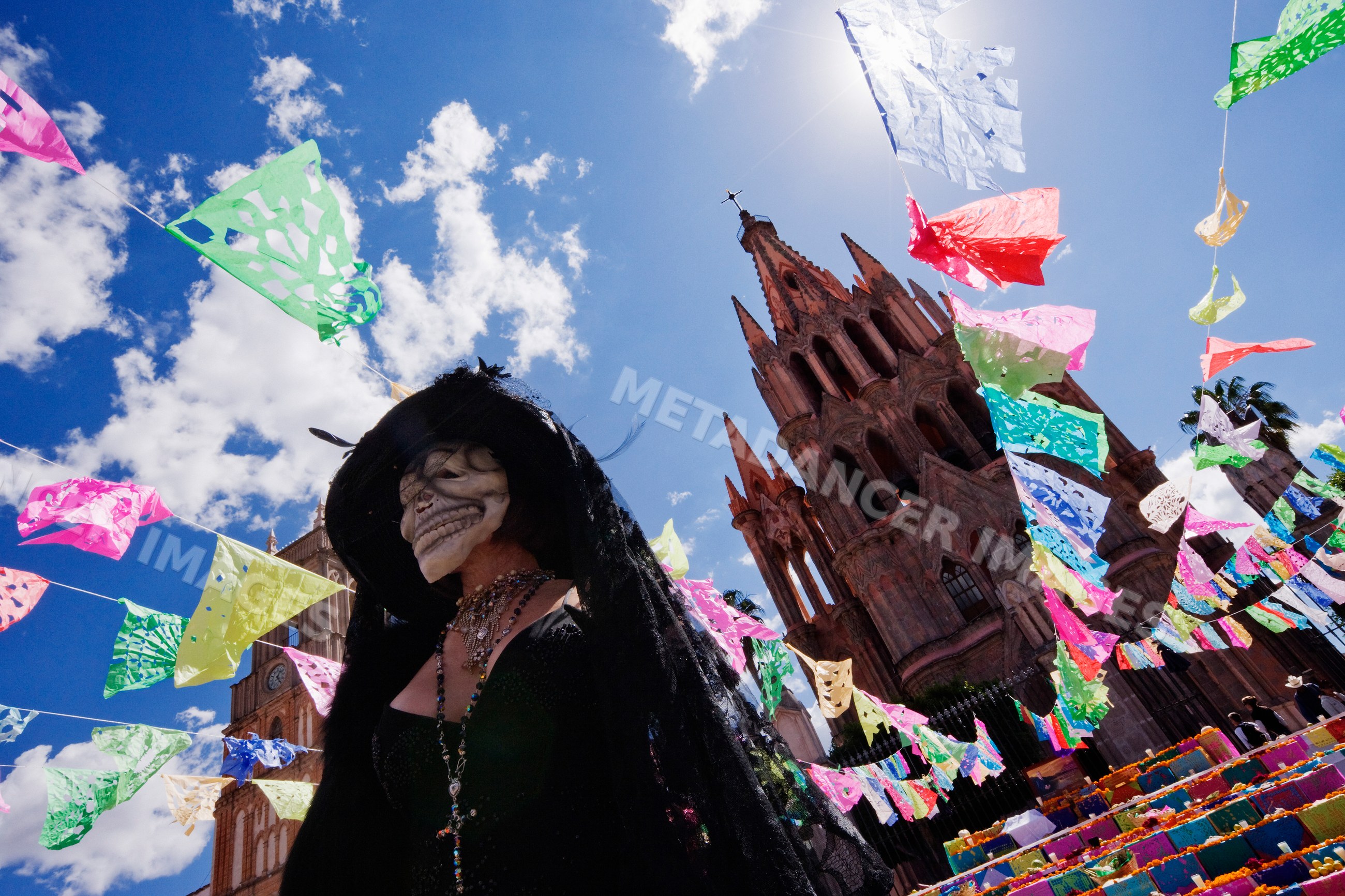Woman wearing calavera mask at day of the dead festival